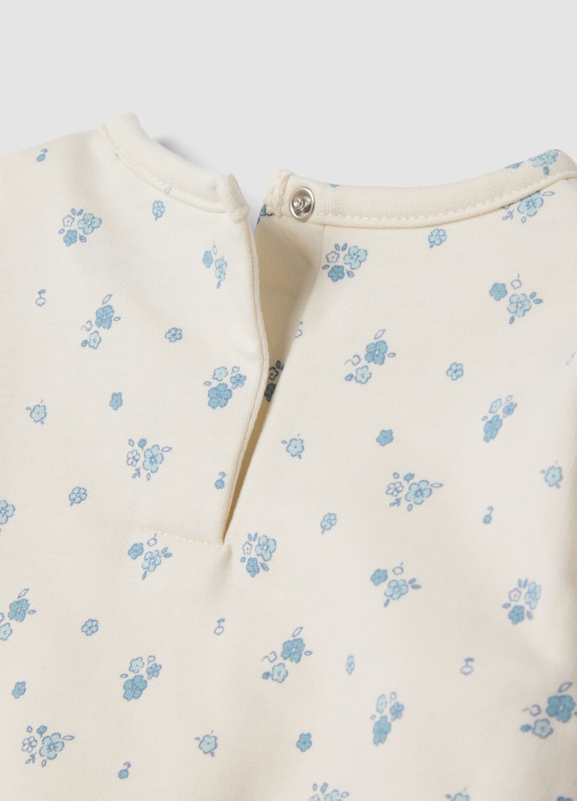 White organic cotton baby pyjamas with all-over print