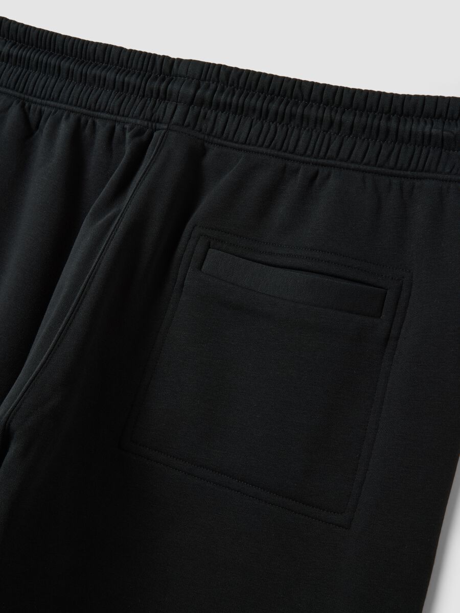 Black cotton-blend joggers with cuffed hems and drawstring waist_1
