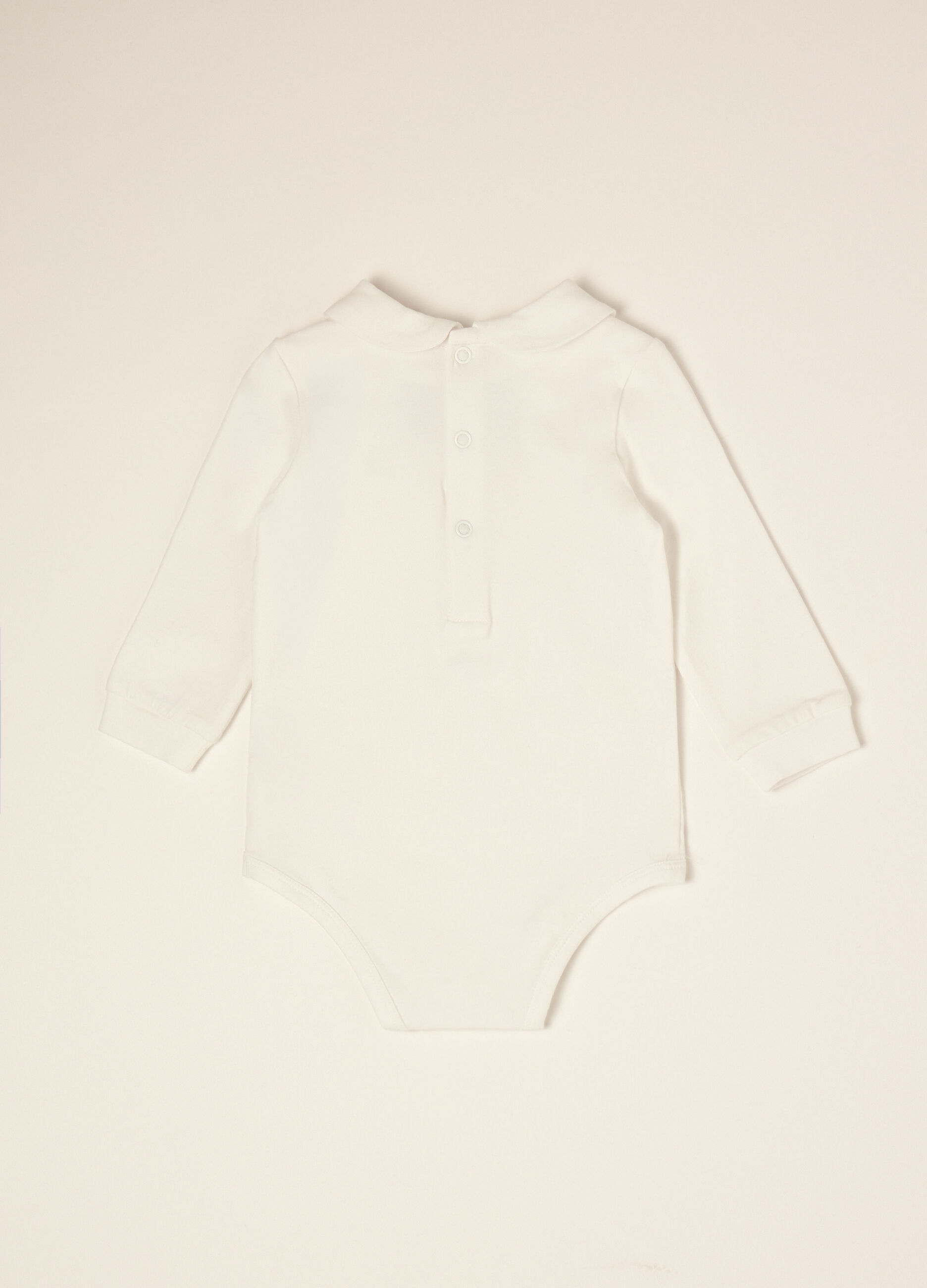 White organic stretch cotton baby bodysuit with bow