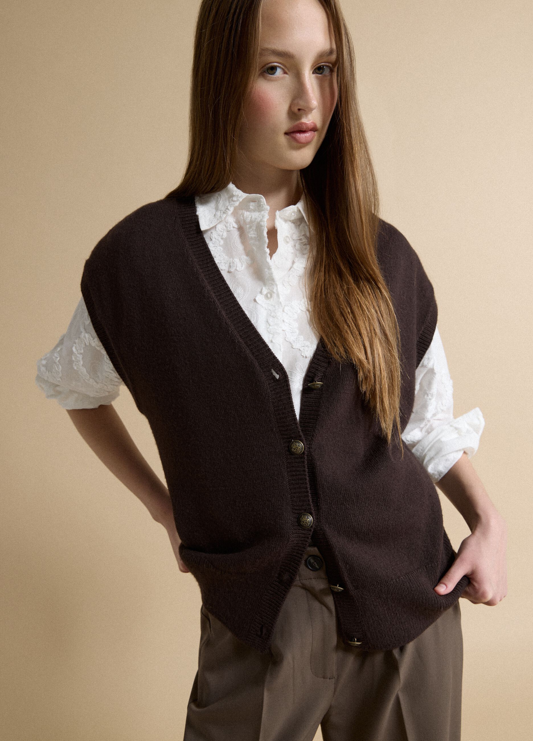 Brown V-neck button-up vest with oversized fit