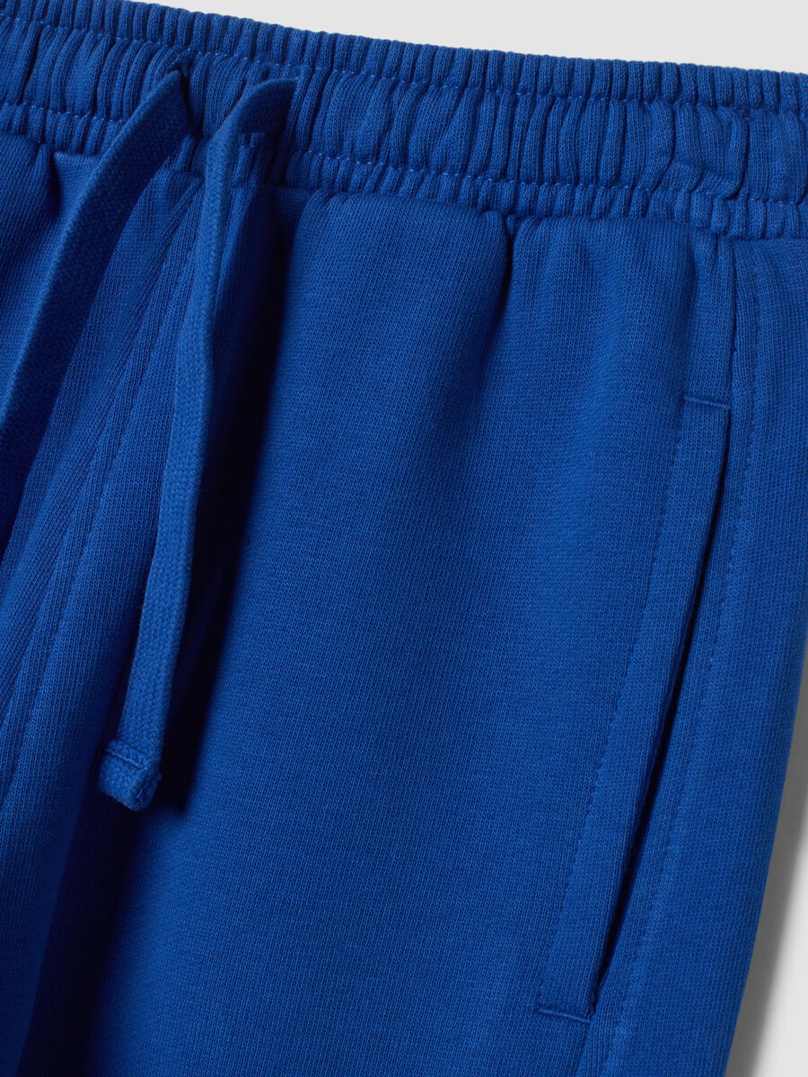 Blue organic cotton jogger trousers with print_3