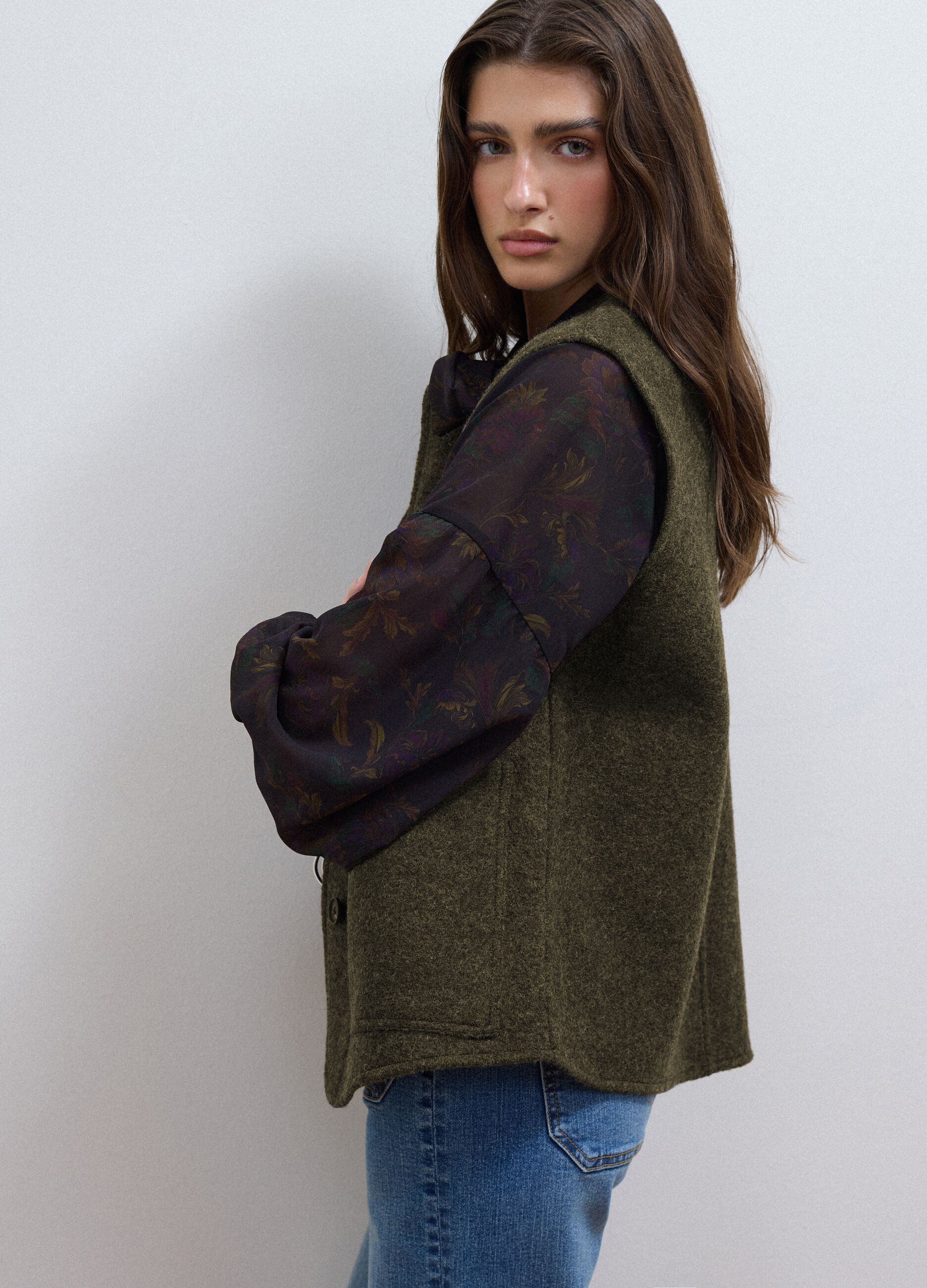Green pure wool crew-neck gilet with oversized fit