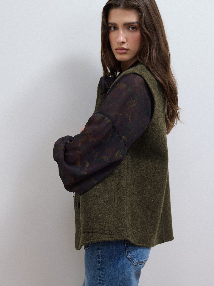 Green pure wool crew-neck gilet with oversized fit_1