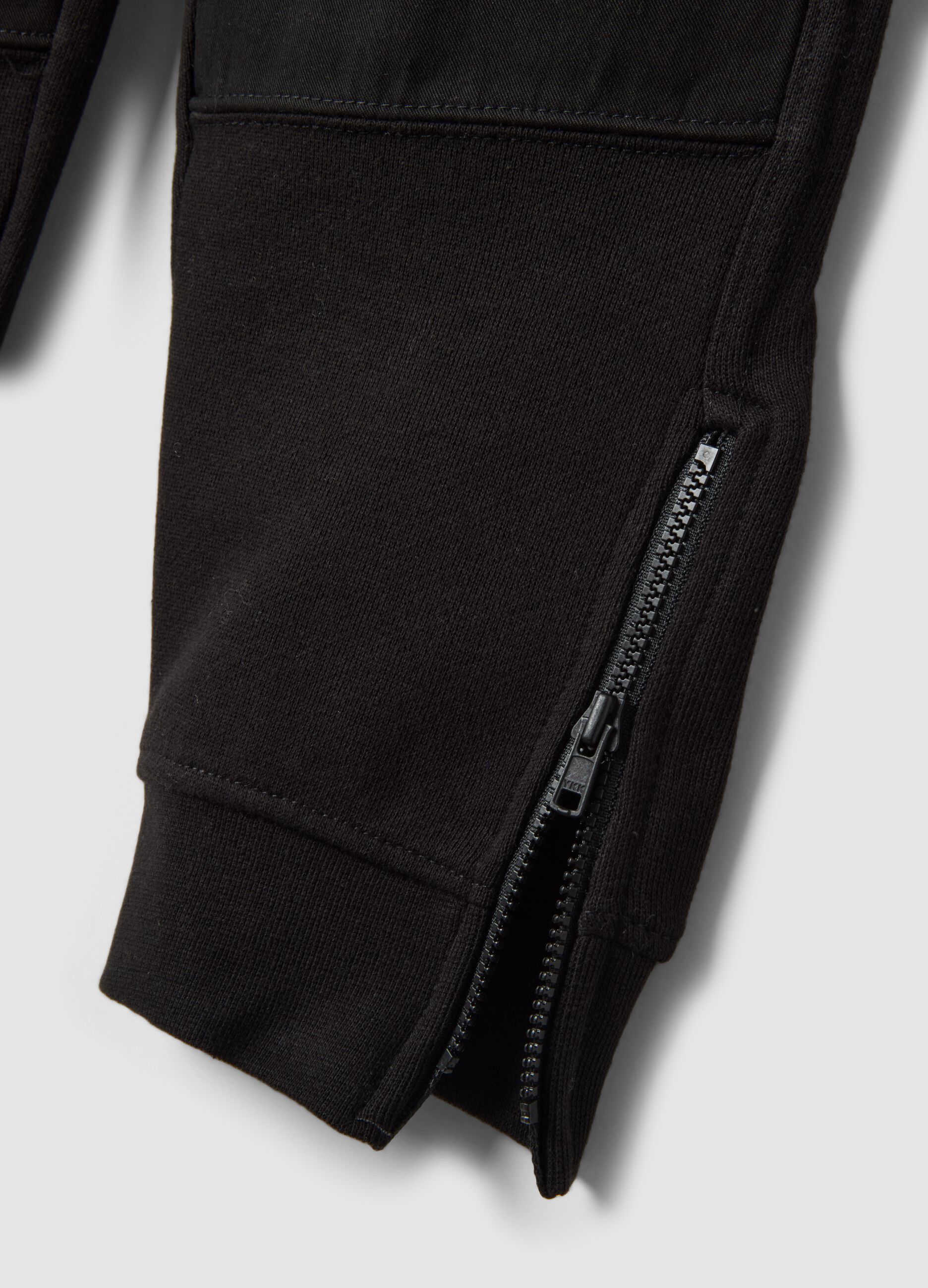 Black cotton-blend joggers with ankle zips