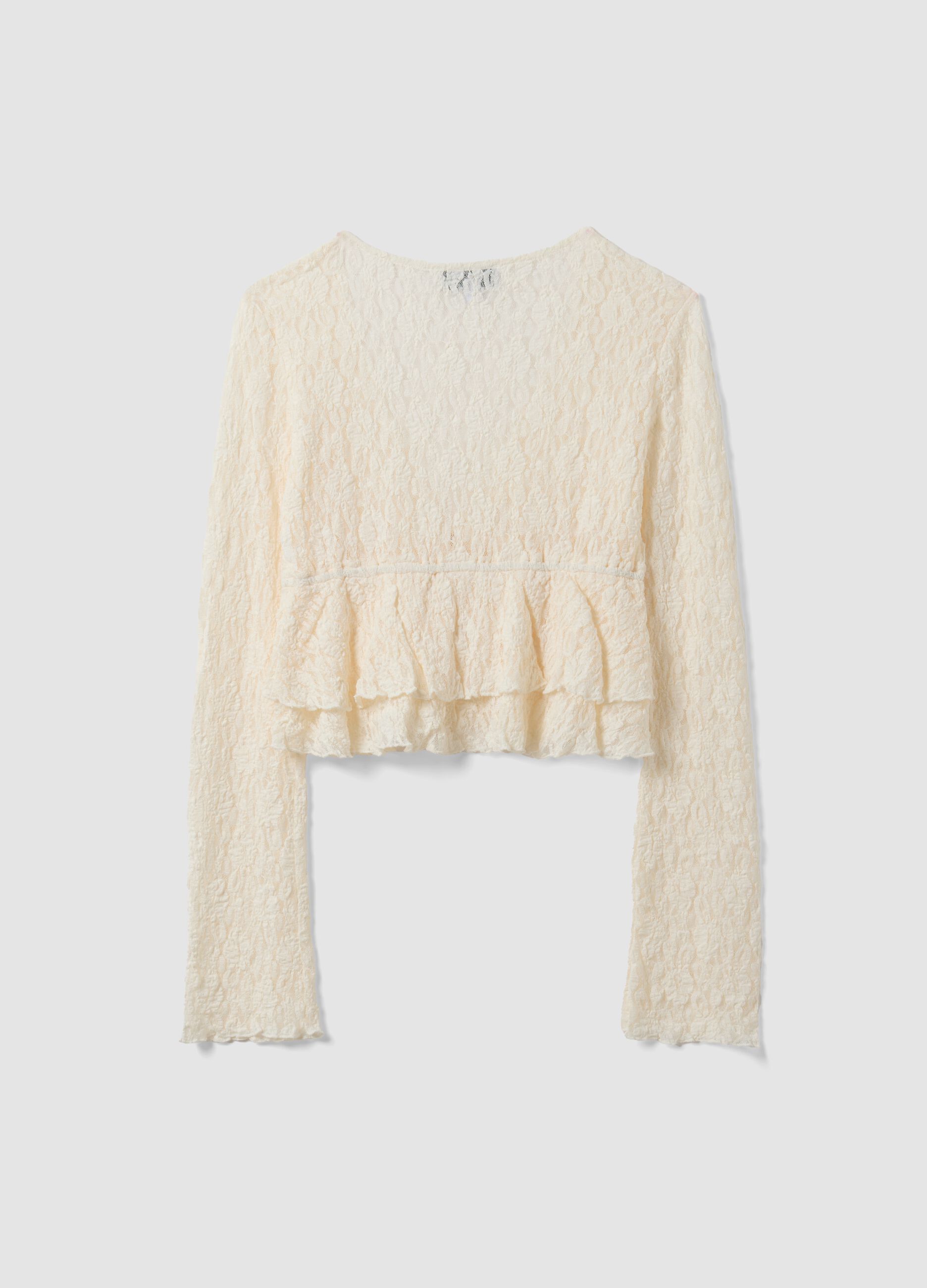 White stretch fabric top with deep V-neck and ruffle hem