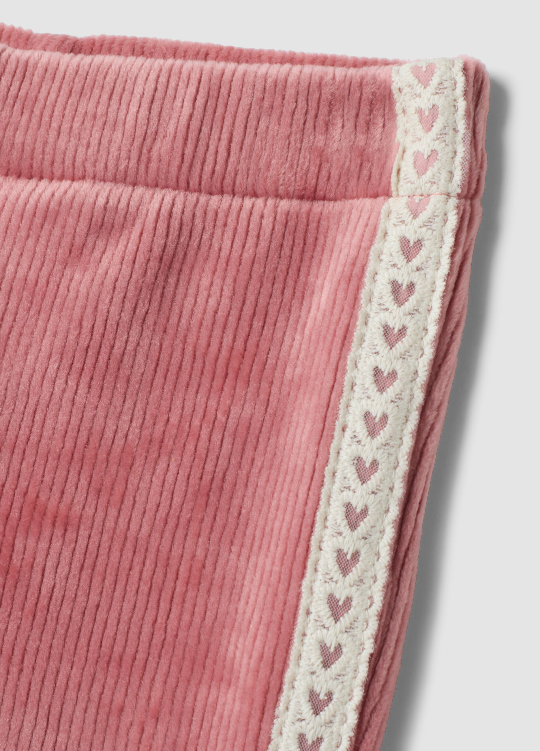 Pantaloni flare rosa in tessuto elasticizzato a costine