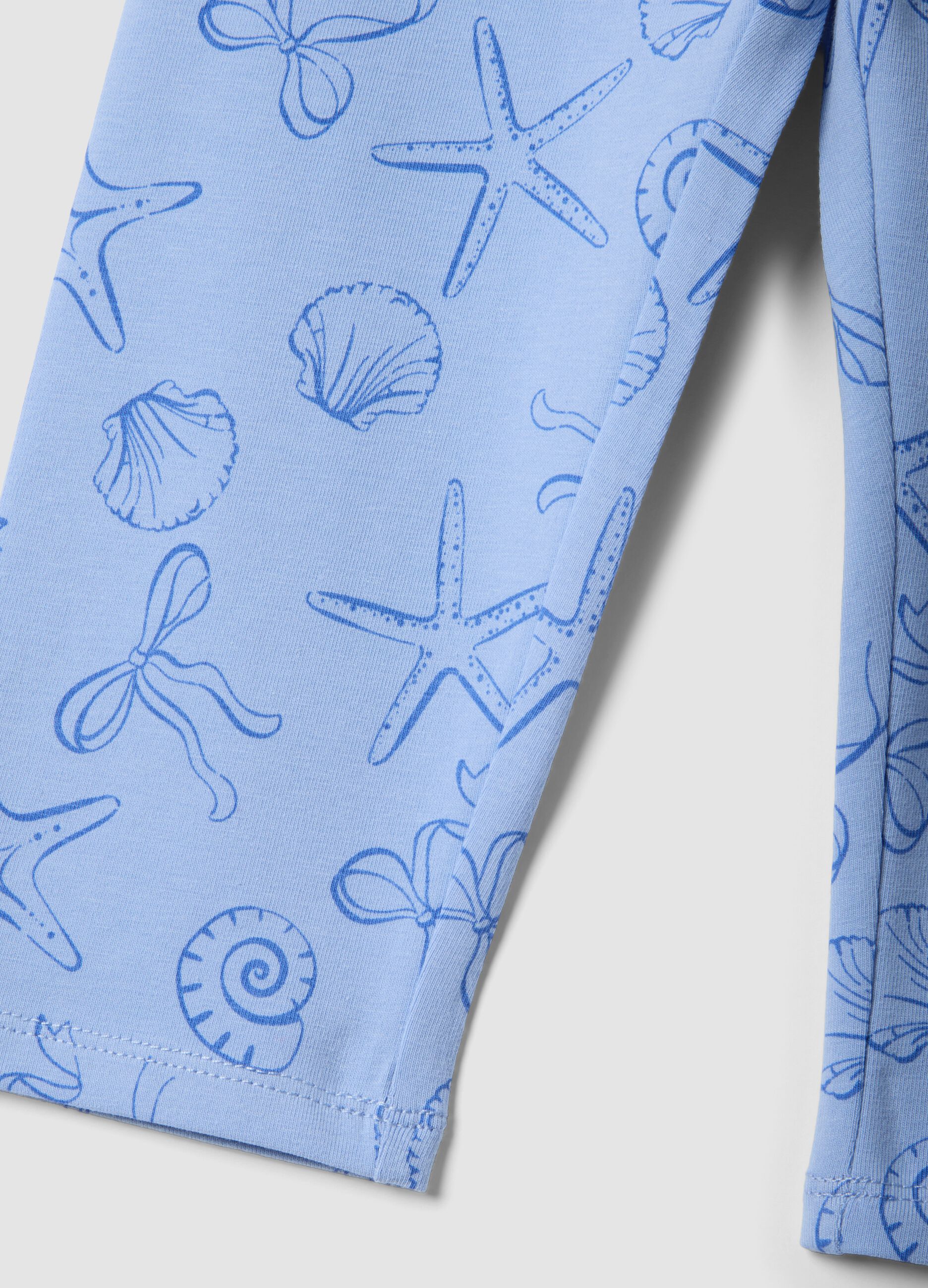 Girls&rsquo; light blue skinny stretch cotton leggings with print