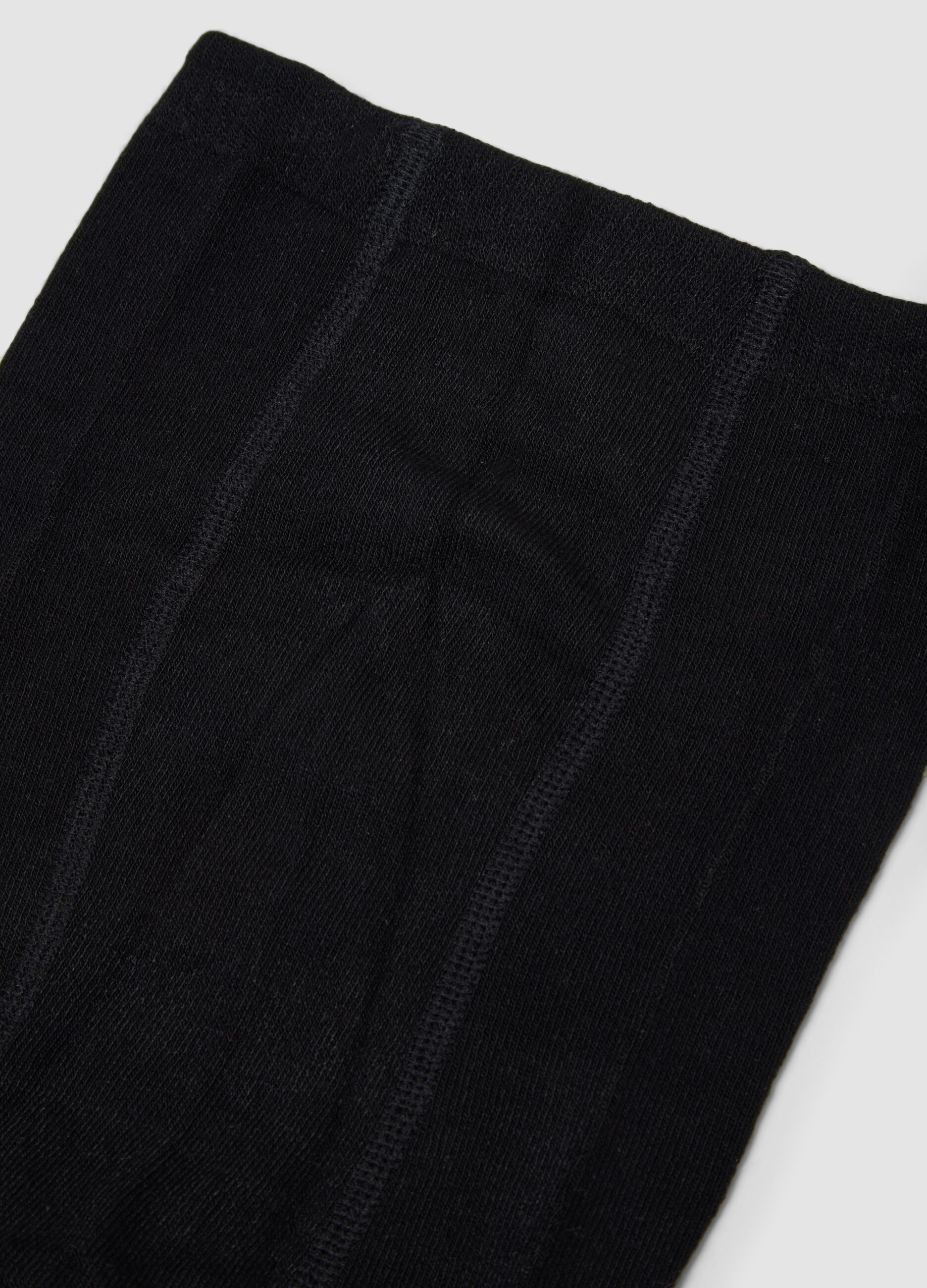 Collant neri in tessuto elasticizzato con fiocchetto