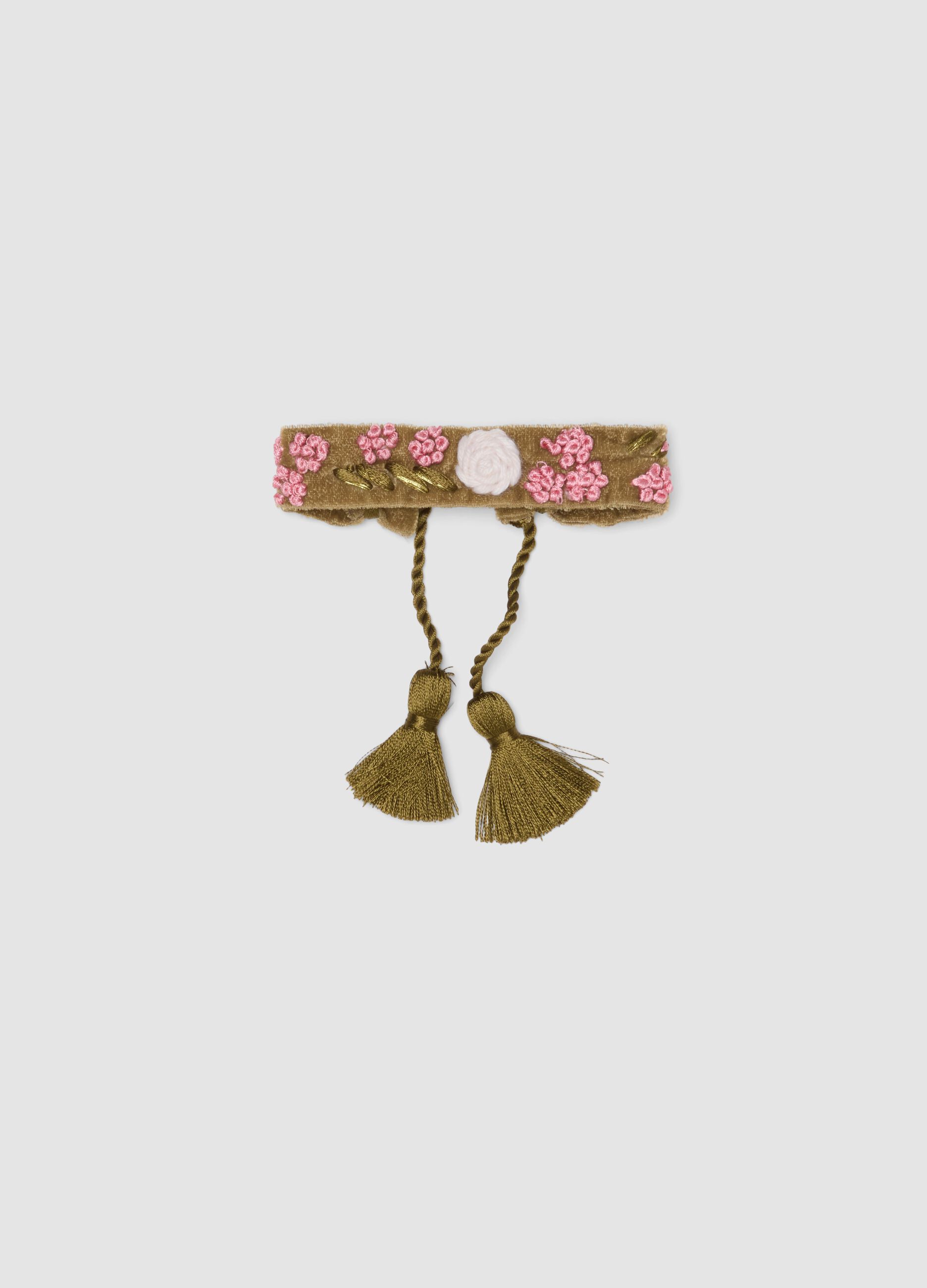 Green bracelet with embroidered flowers and tassels