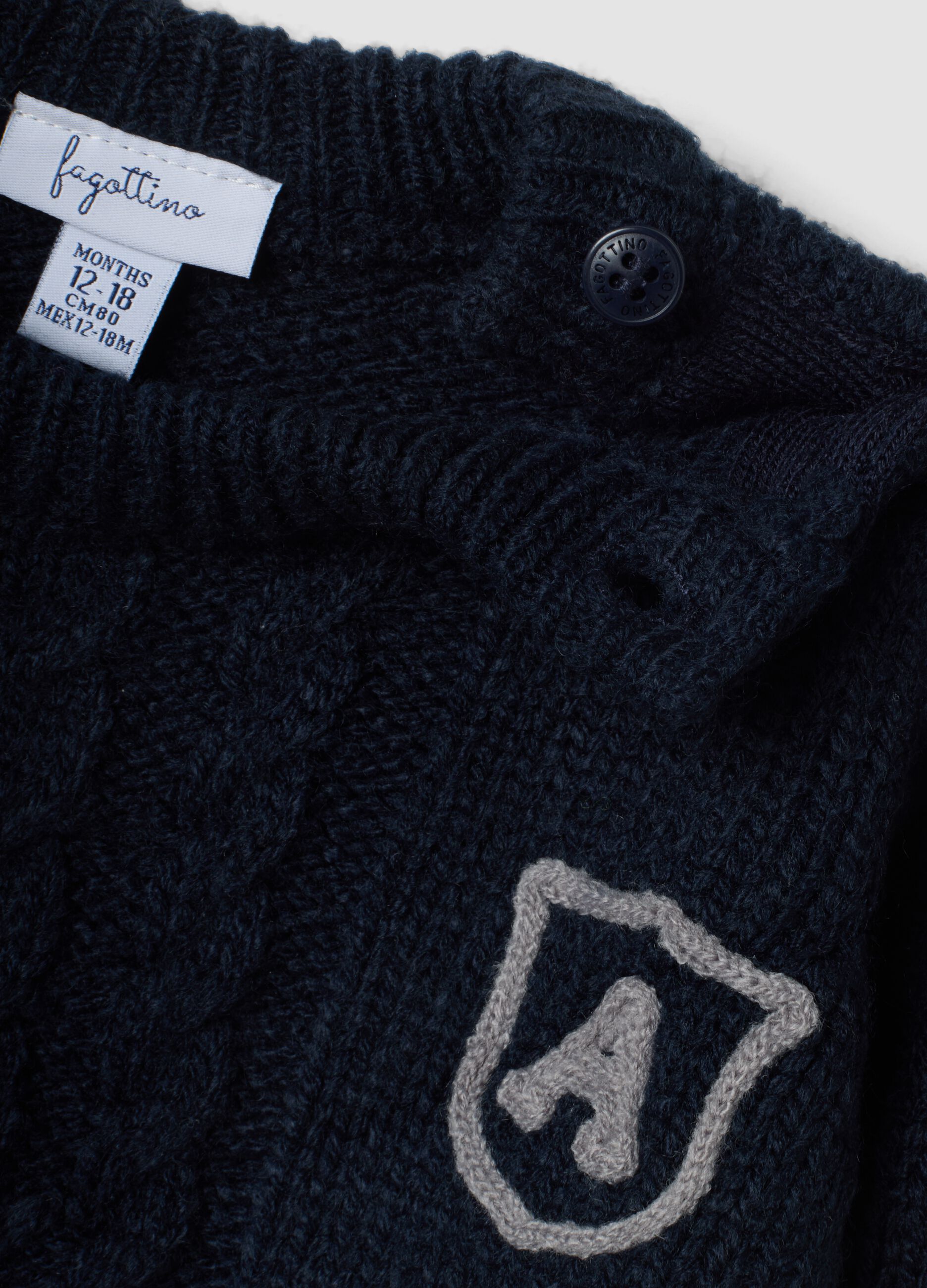 Blue crew-neck cable-knit jumper