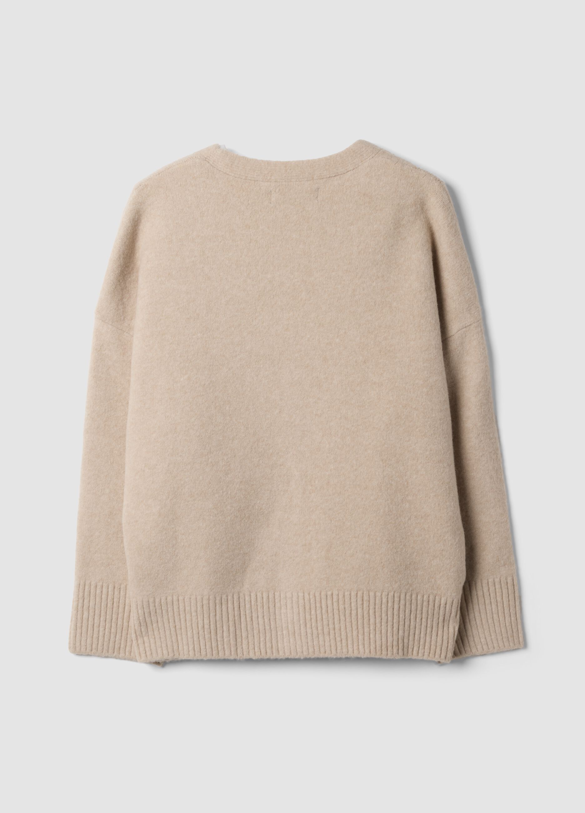 Cardigan beige in lana elasticizzata con scollo profondo a V