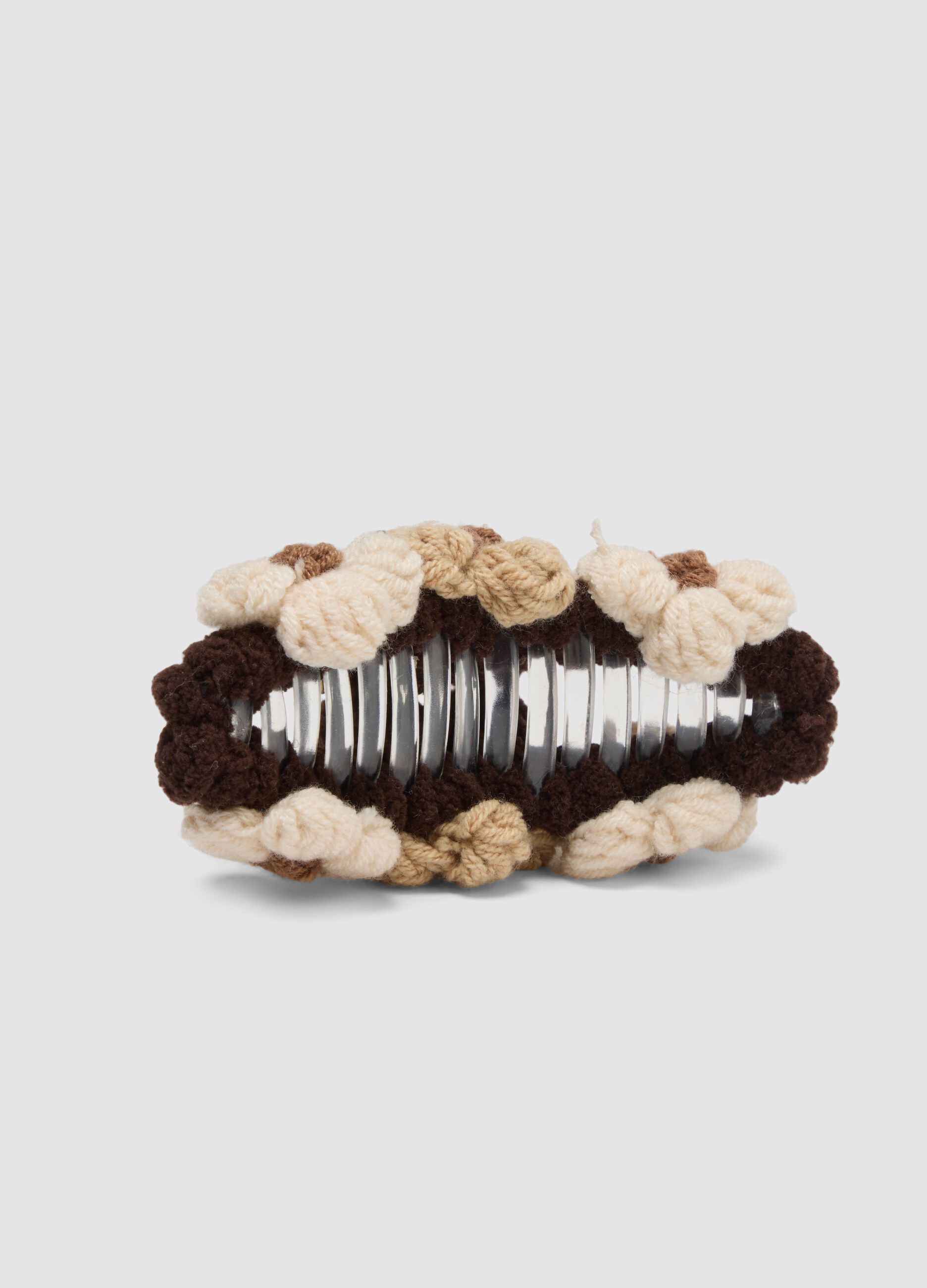 Brown hair claw clip with textured floral details
