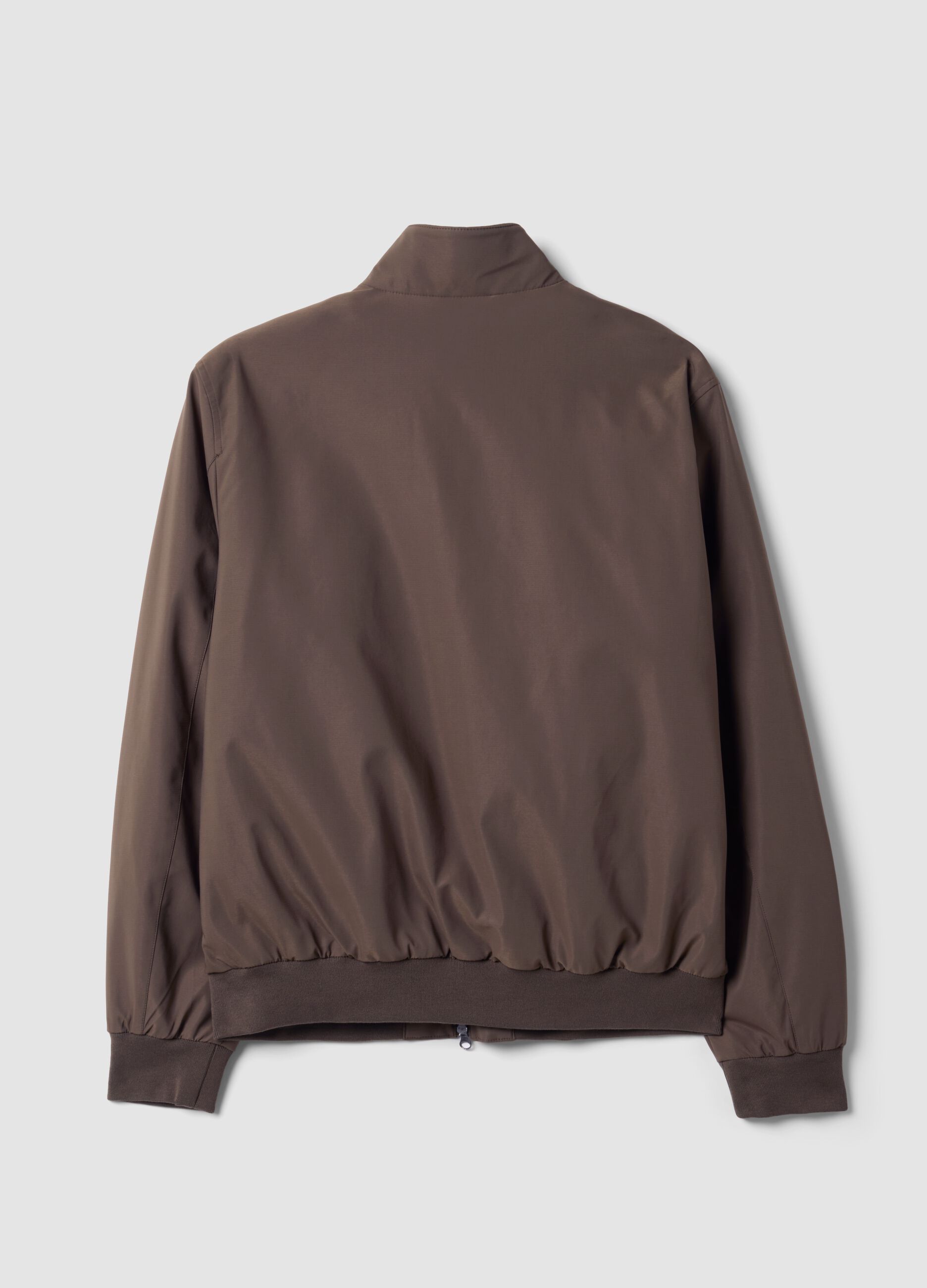Green padded jacket in a regular fit with zip and high collar