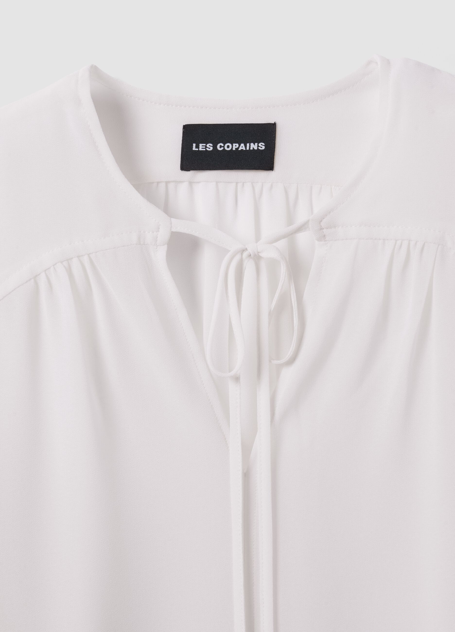 White regular-fit blouse with V-neck and tie detail
