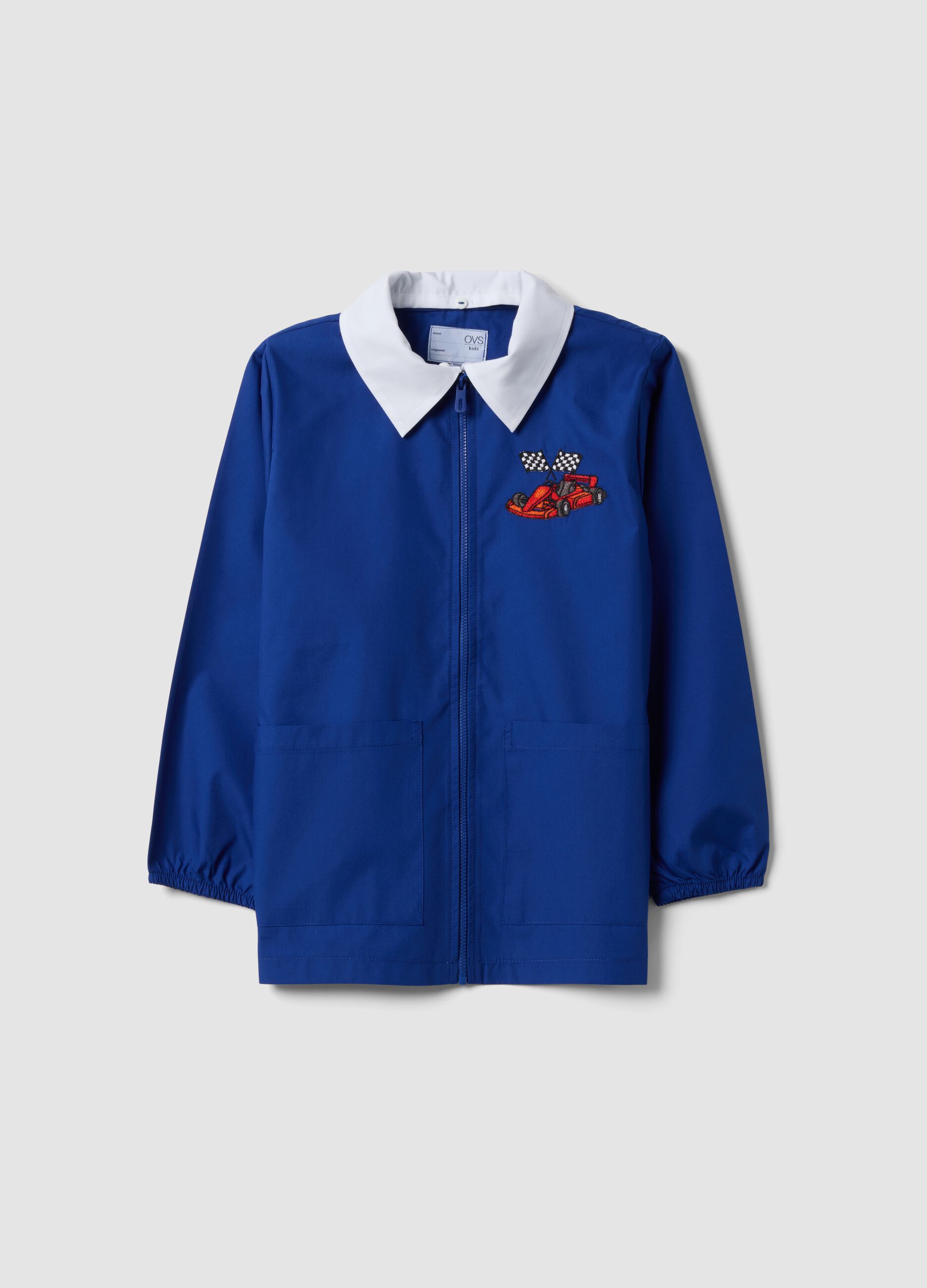 Customisable blue school apron with zip and go-kart embroidery for boys