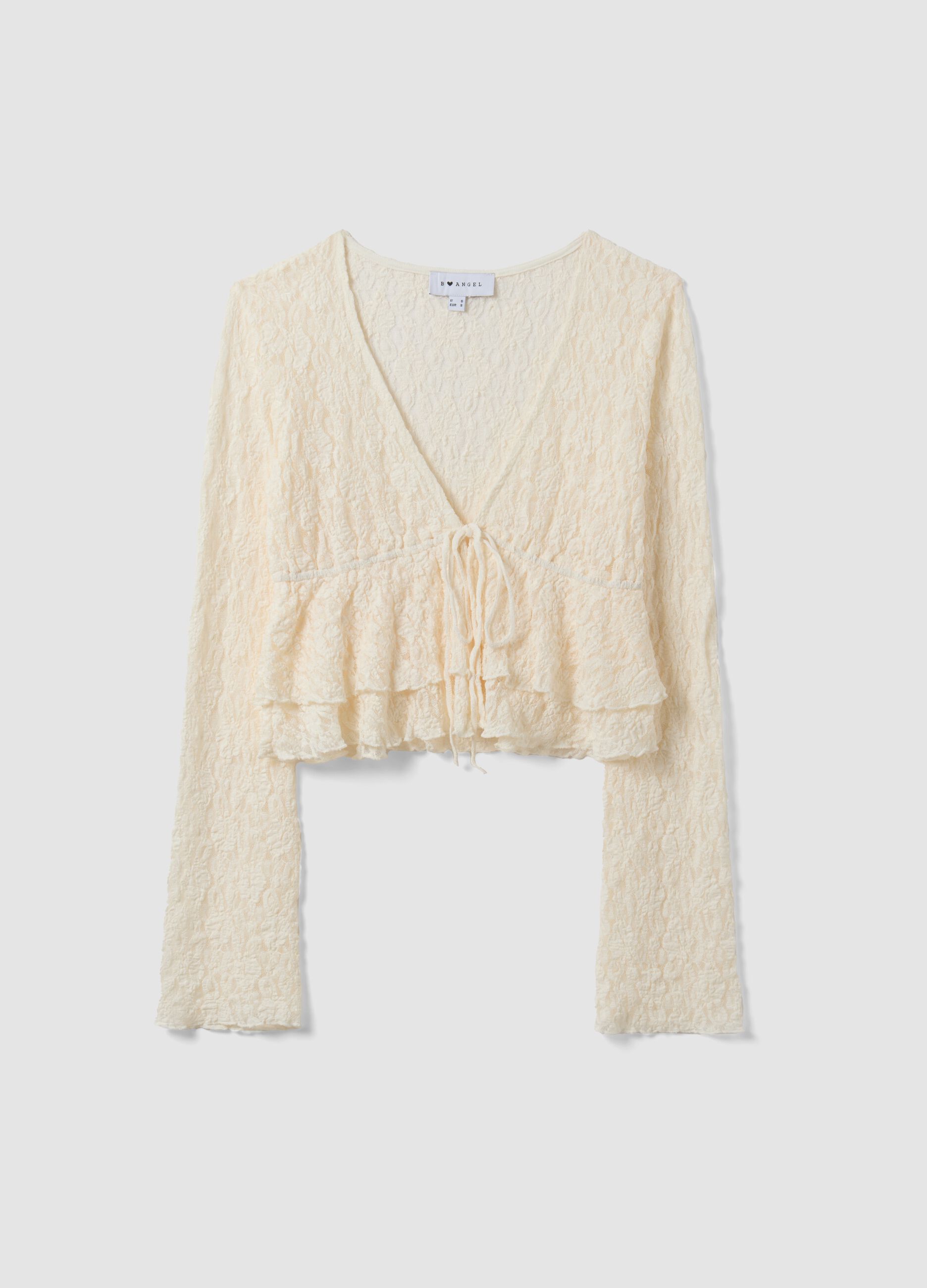 White stretch top with deep V-neck and ruffle trim