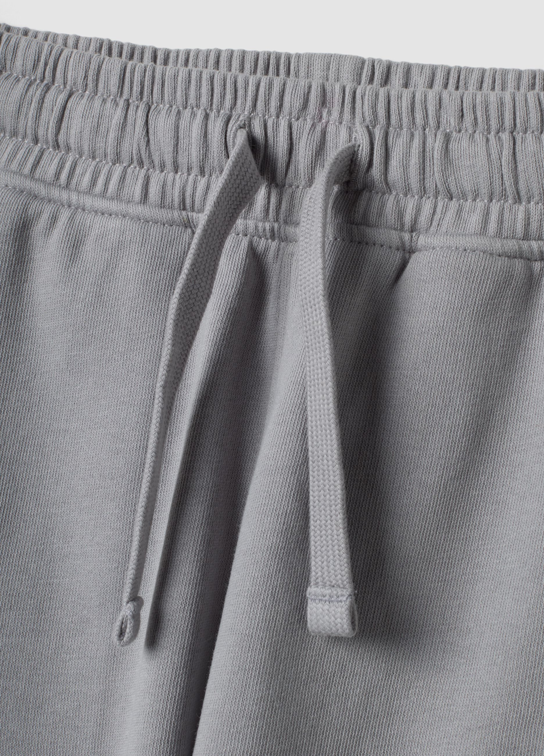 Pantaloni jogger grigi in puro cotone con fondo elastico