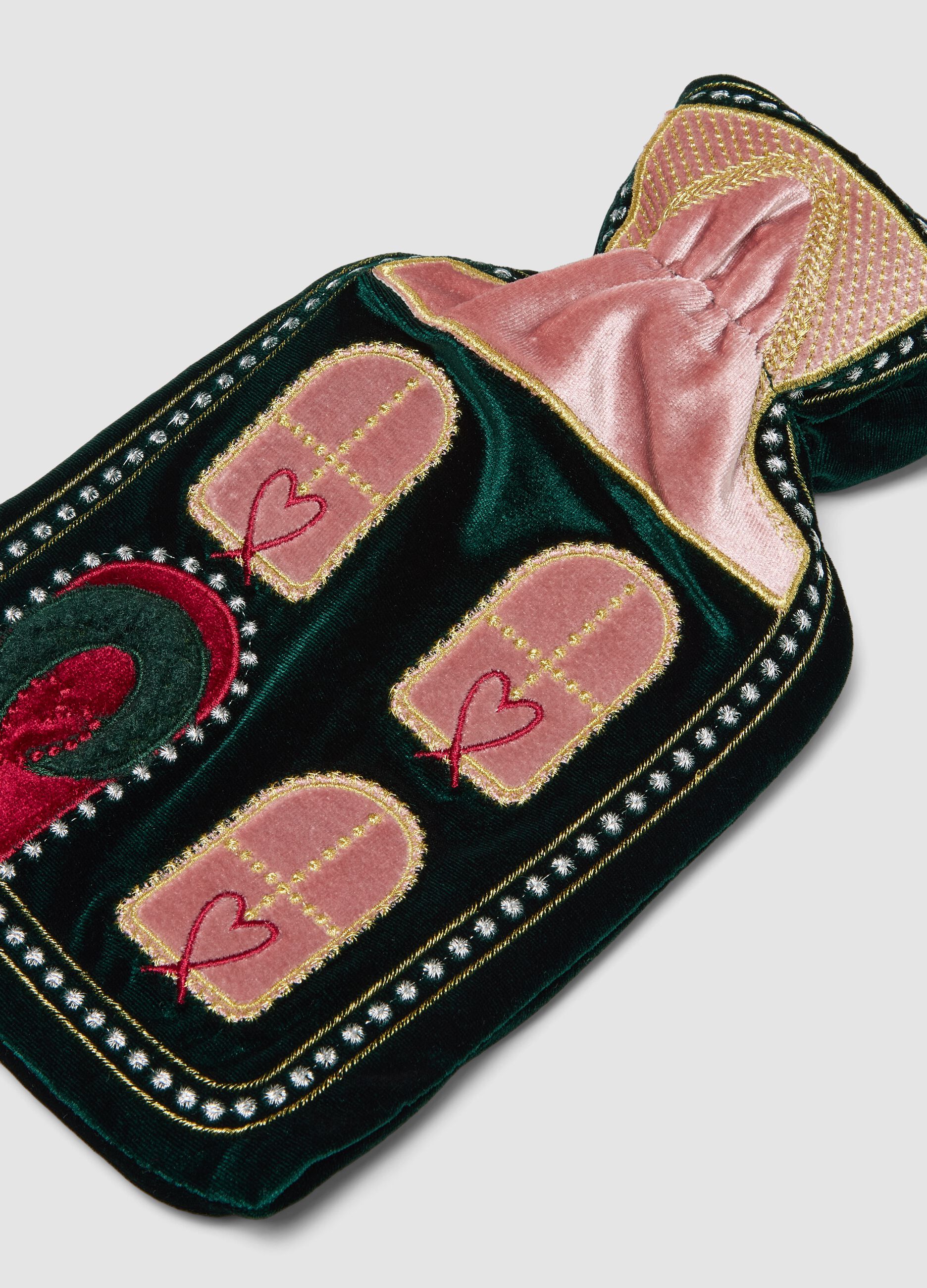 Green and pink hot water bottle with decorative embroidery