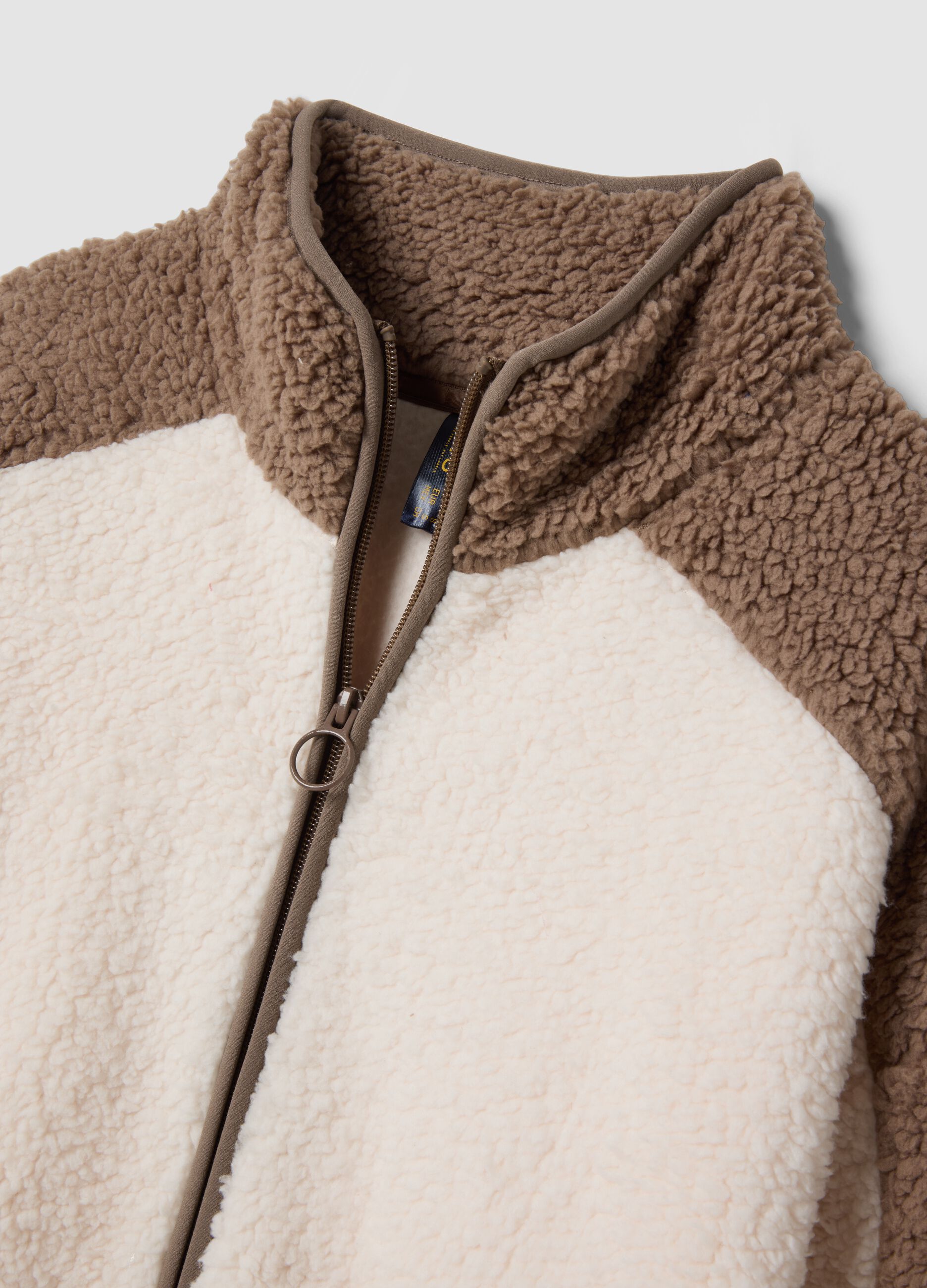 Soft white zip-up robe with high neck