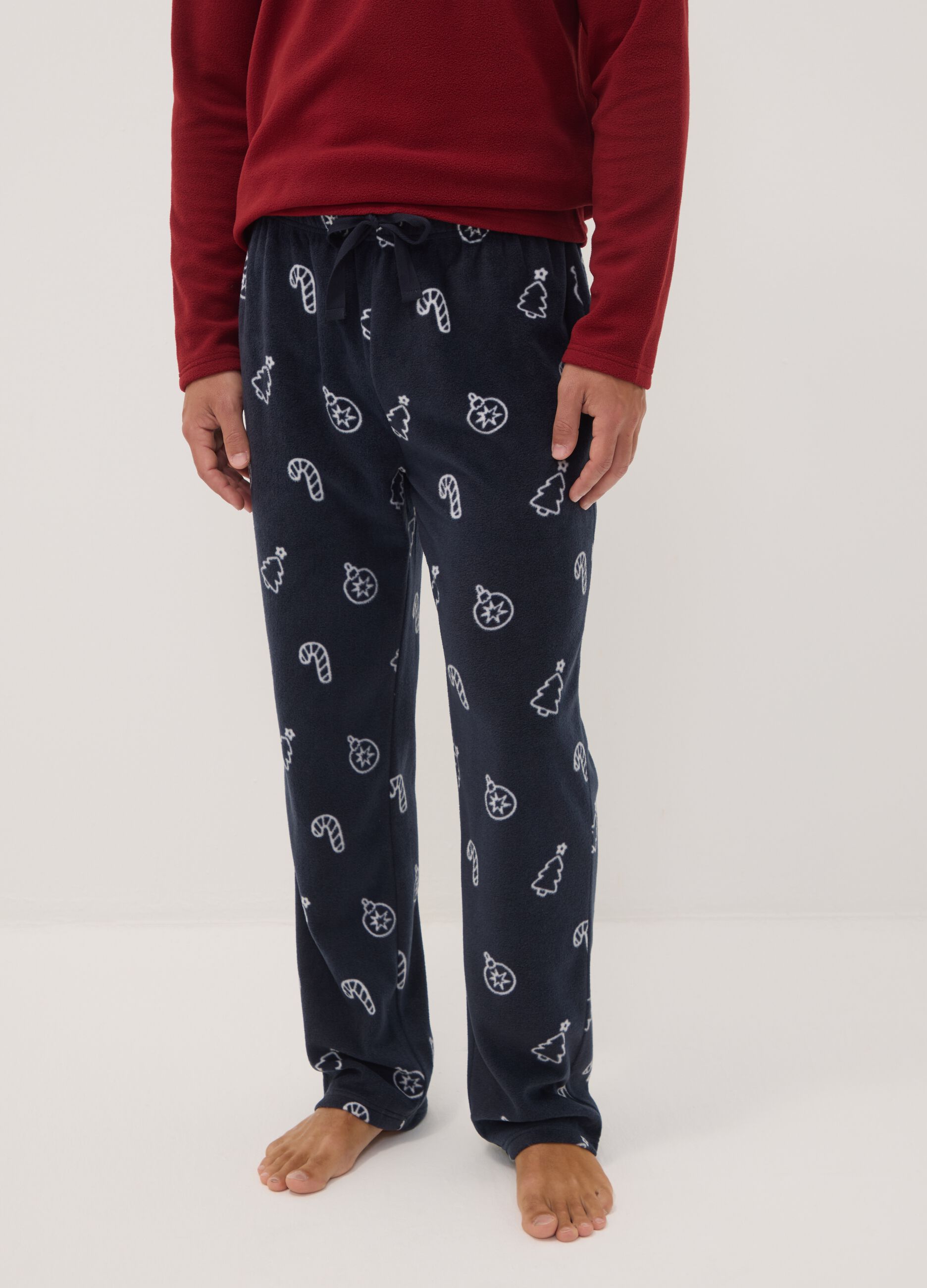 Long red pyjama set with crew neck top and patterned trousers