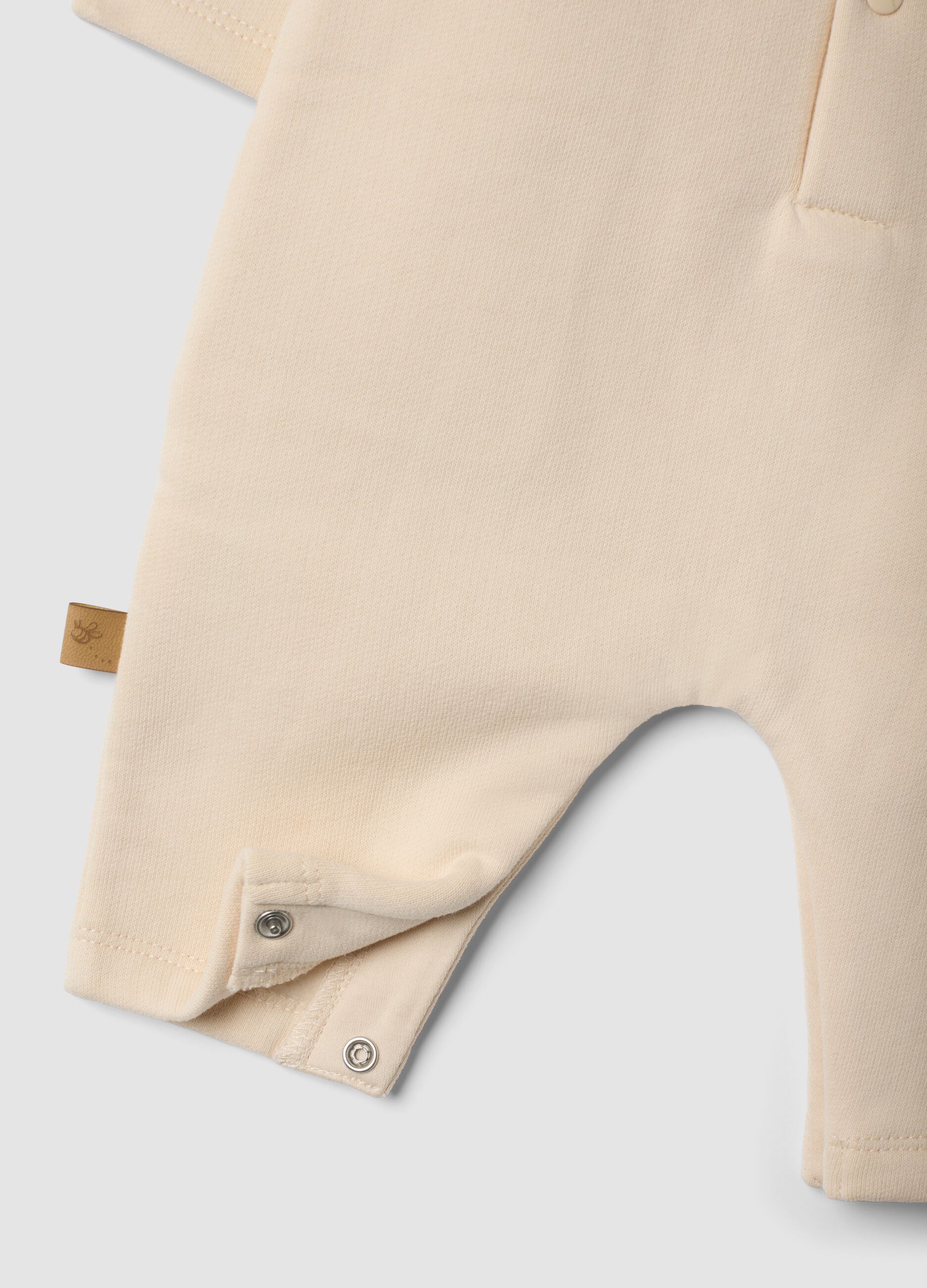 Beige organic cotton Winnie the Pooh babygrow