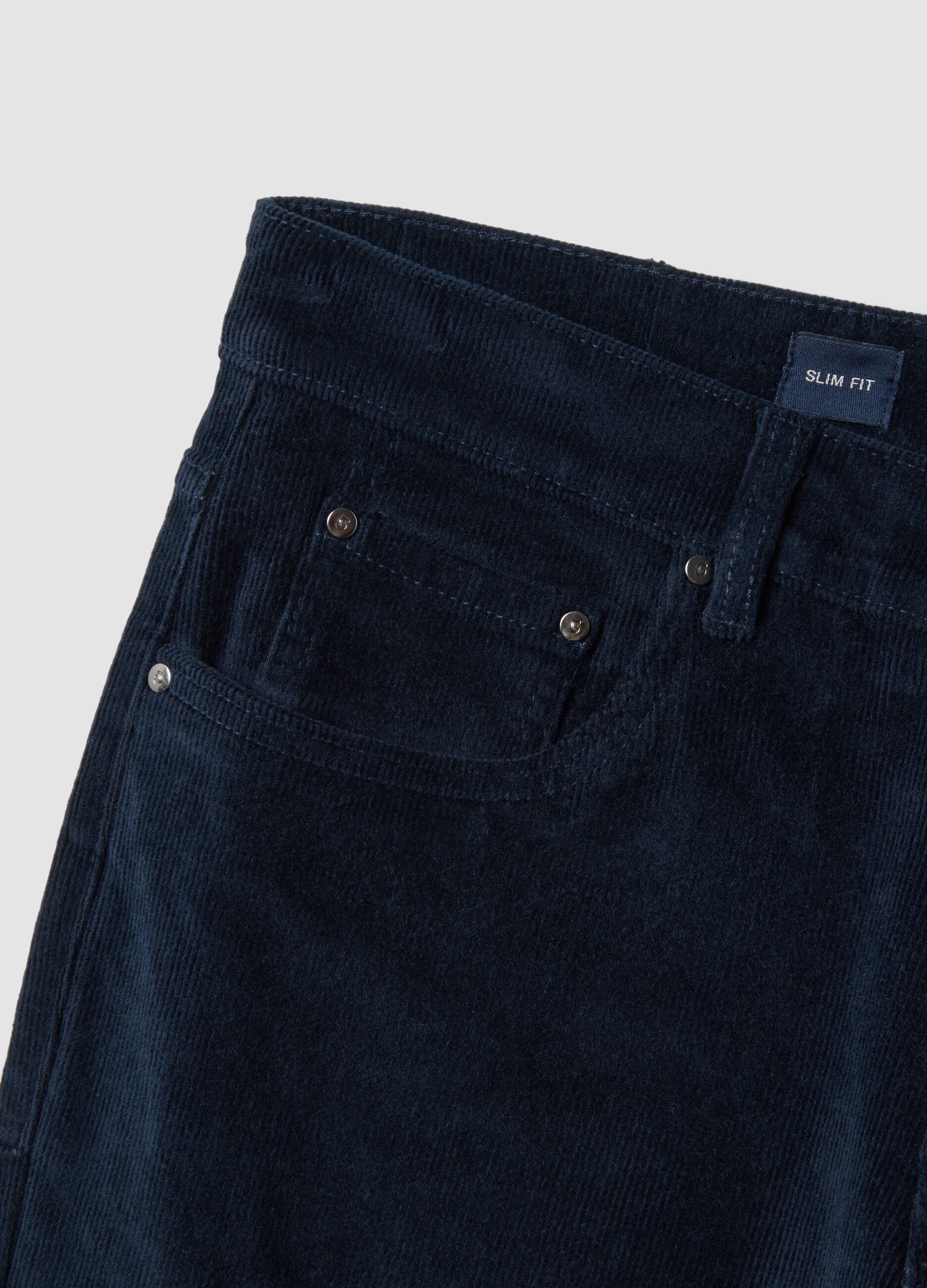 Pantaloni blu in cotone elasticizzato a coste slim fit