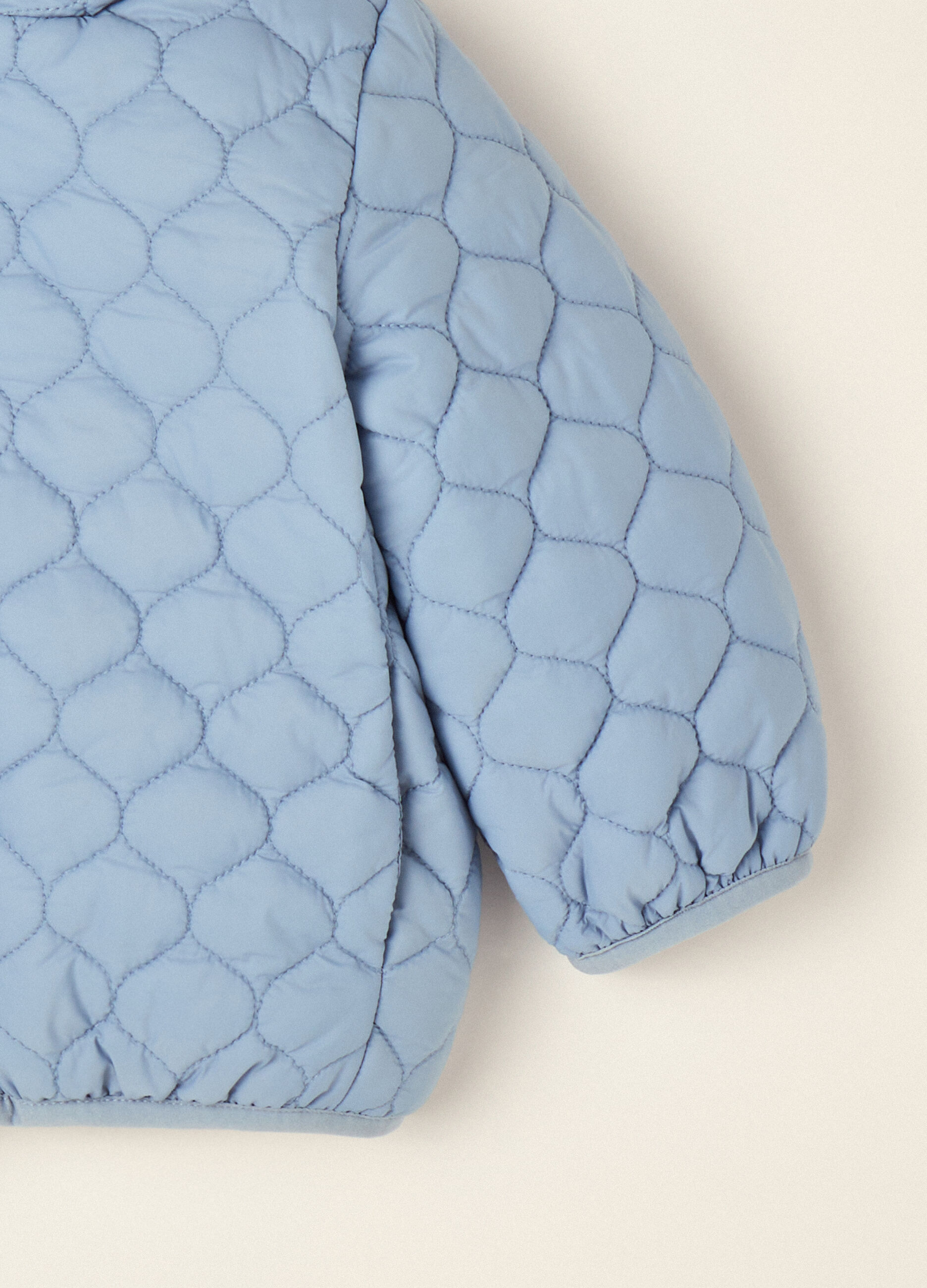 Blue quilted hooded jacket with bear ears