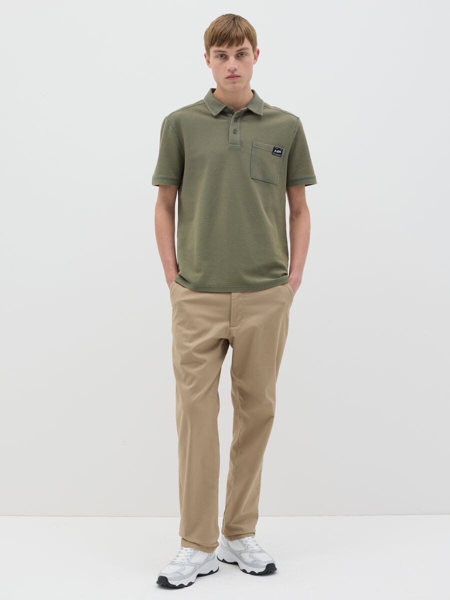 قميص بولو أخضر قصير الأكمام من القطن البيكيه_1