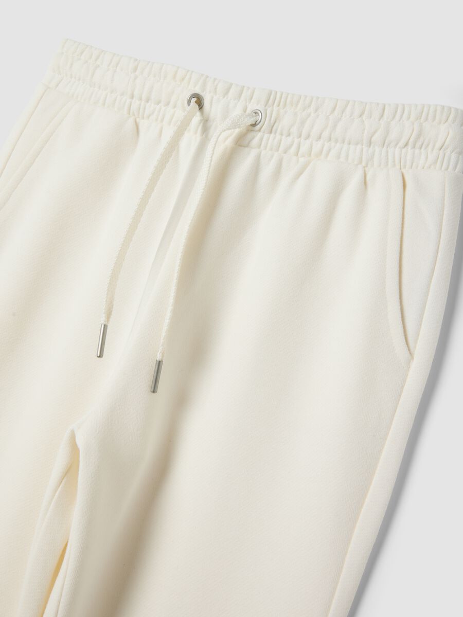 White flare trousers in pure organic cotton_2