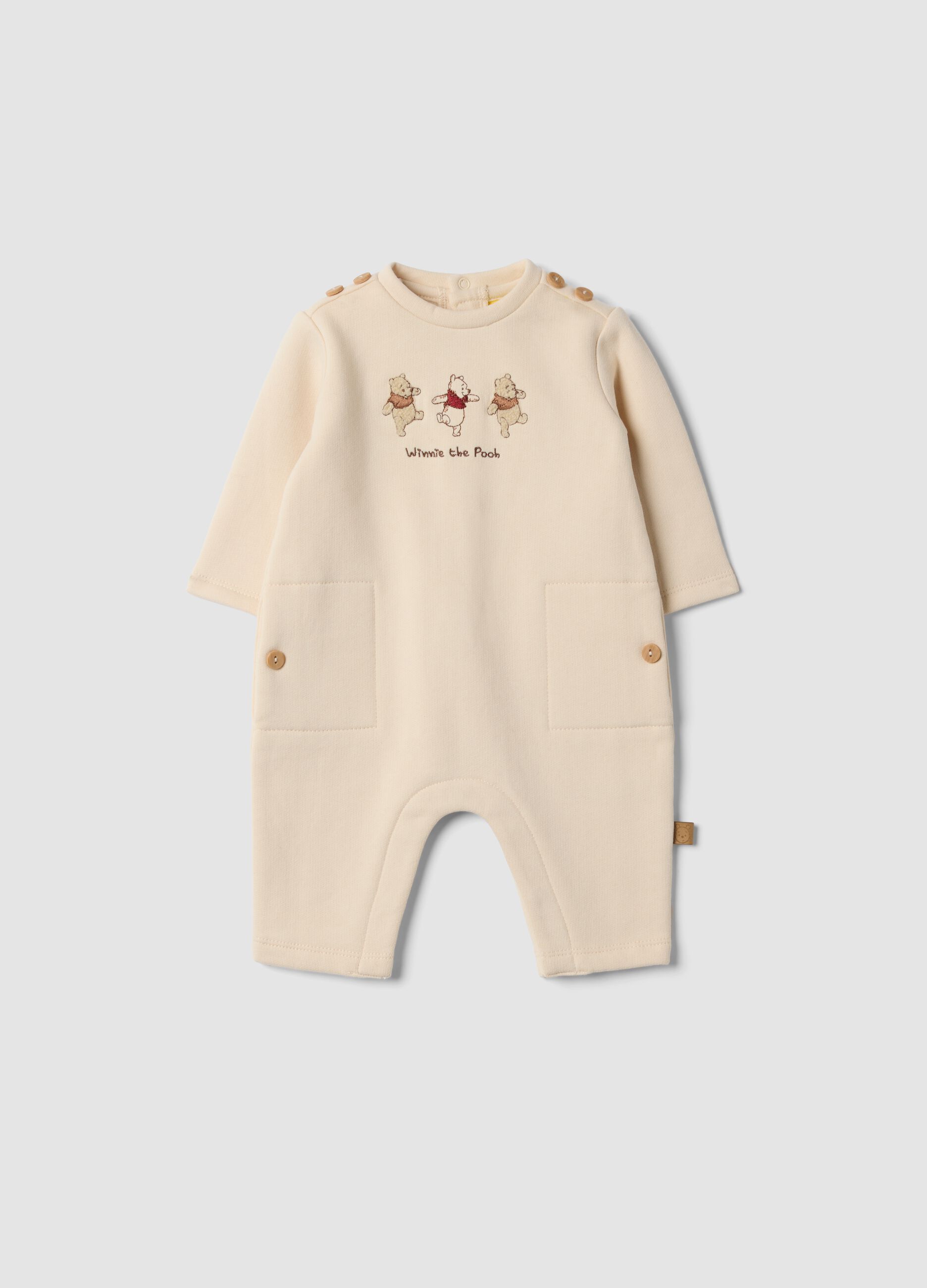 Beige organic cotton Winnie the Pooh babygrow