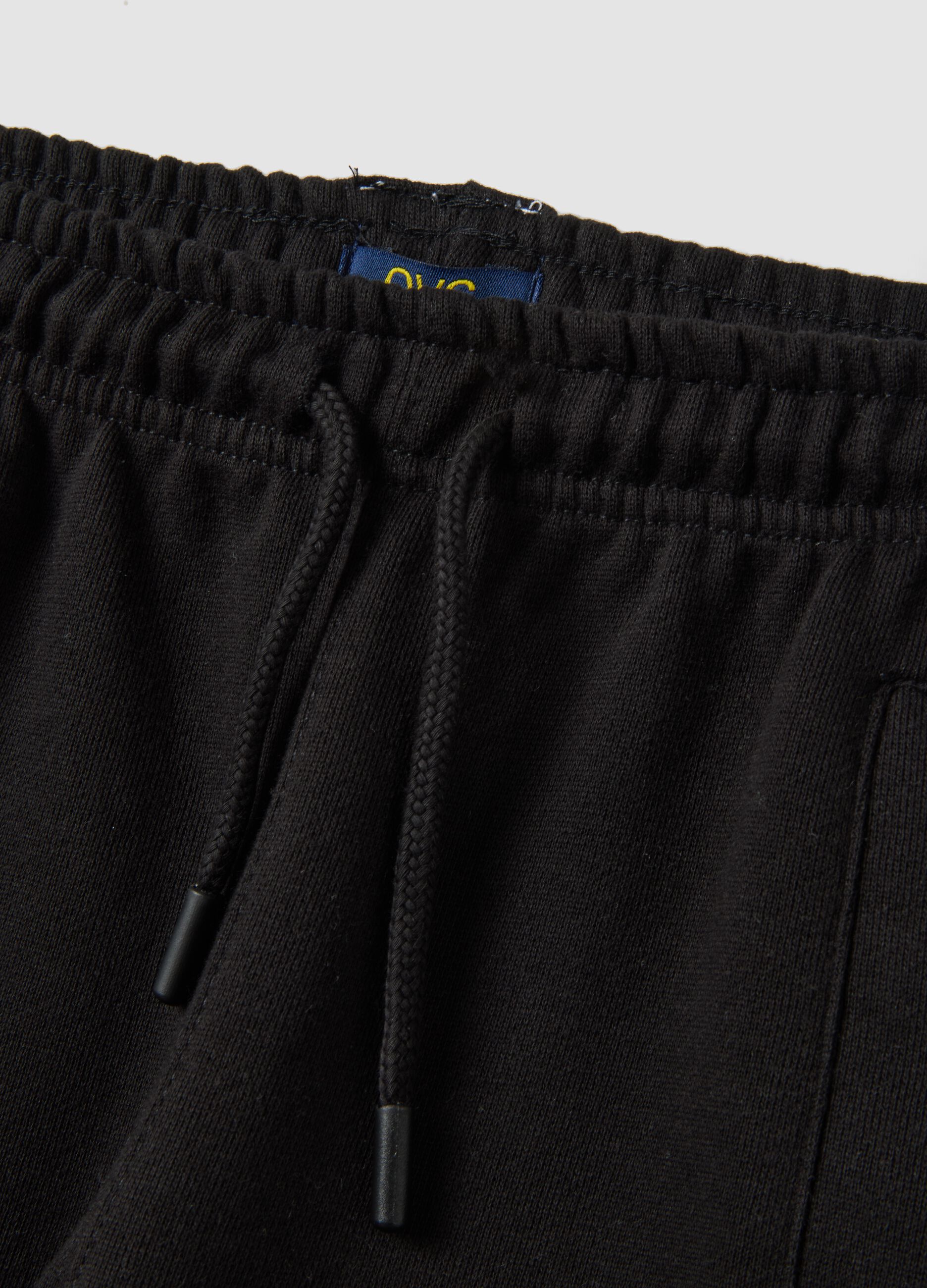 Black cotton-blend joggers with ankle zips
