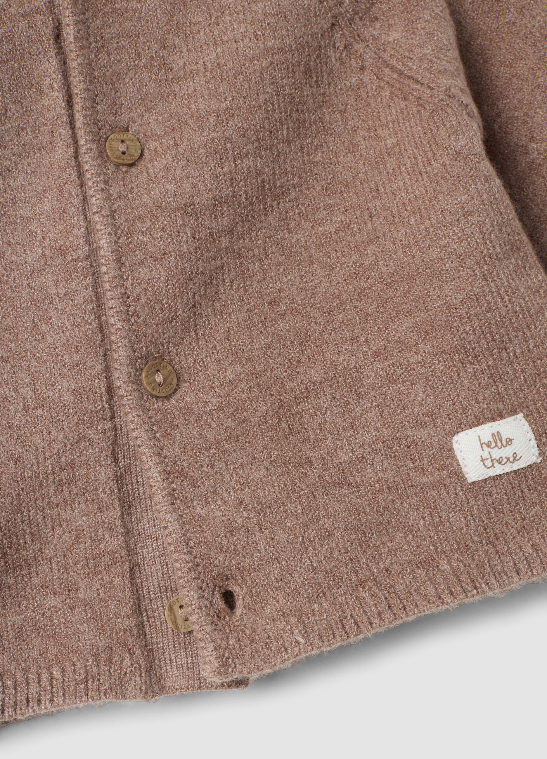 Brown knitted cardigan with crew neck and hood