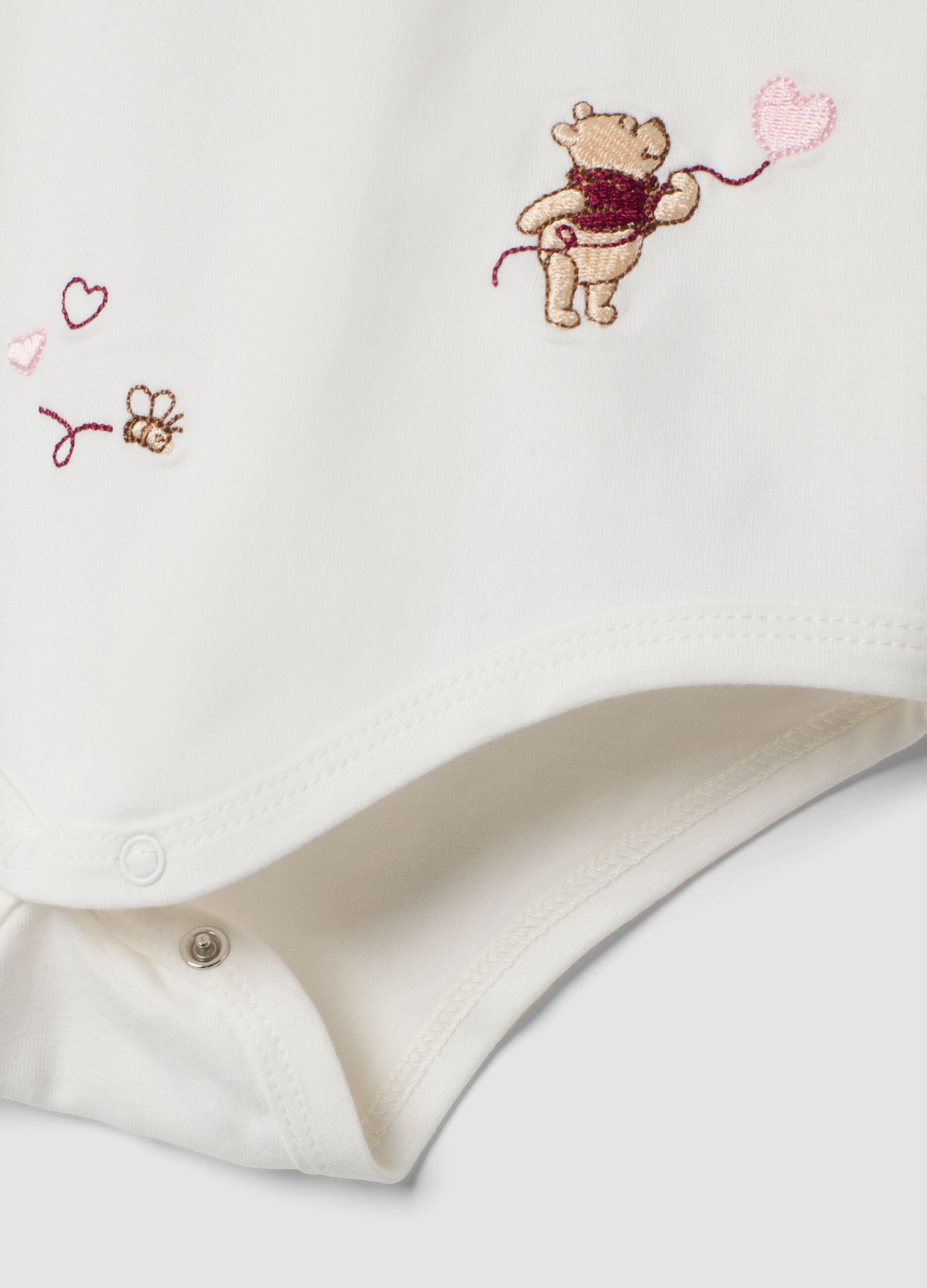 White organic stretch cotton bodysuit with Winnie the Pooh prints