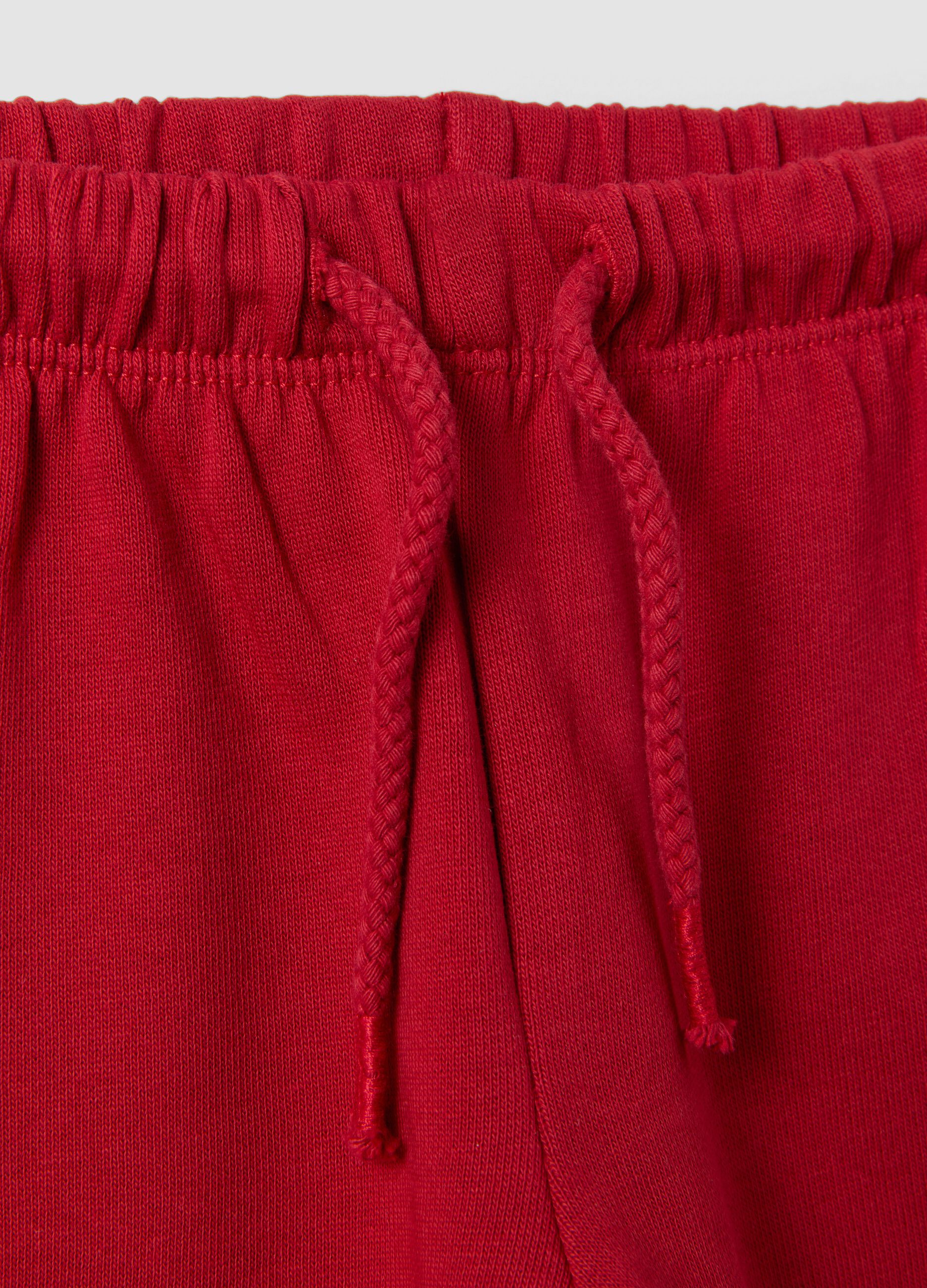 Red pure cotton trousers with elasticated waist and print for baby girls