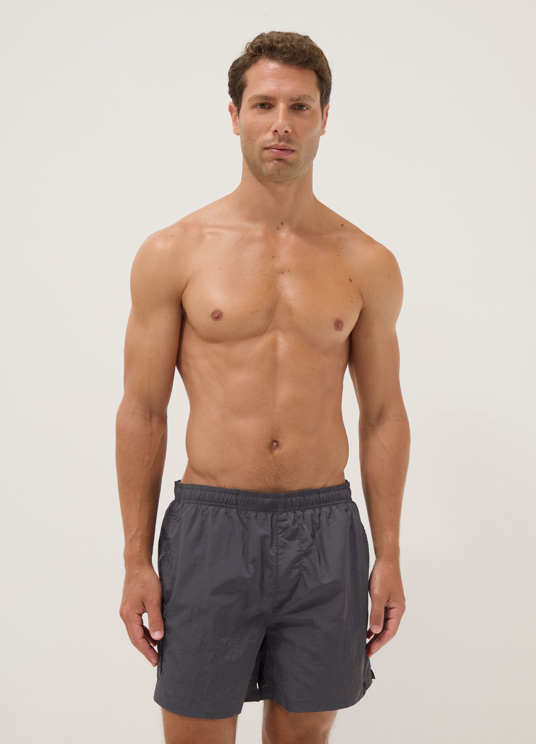 Grey swim shorts with elasticated waistband