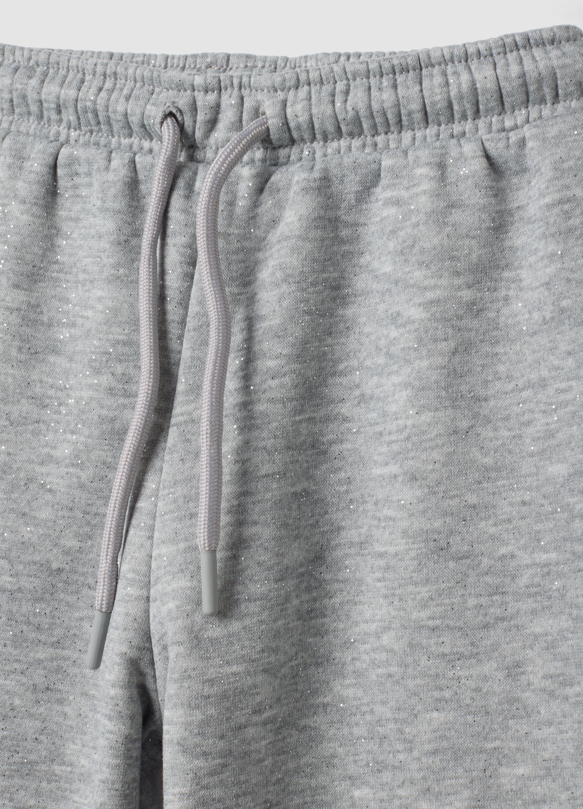 Jogger wide leg grigio melange con vita elasticizzata