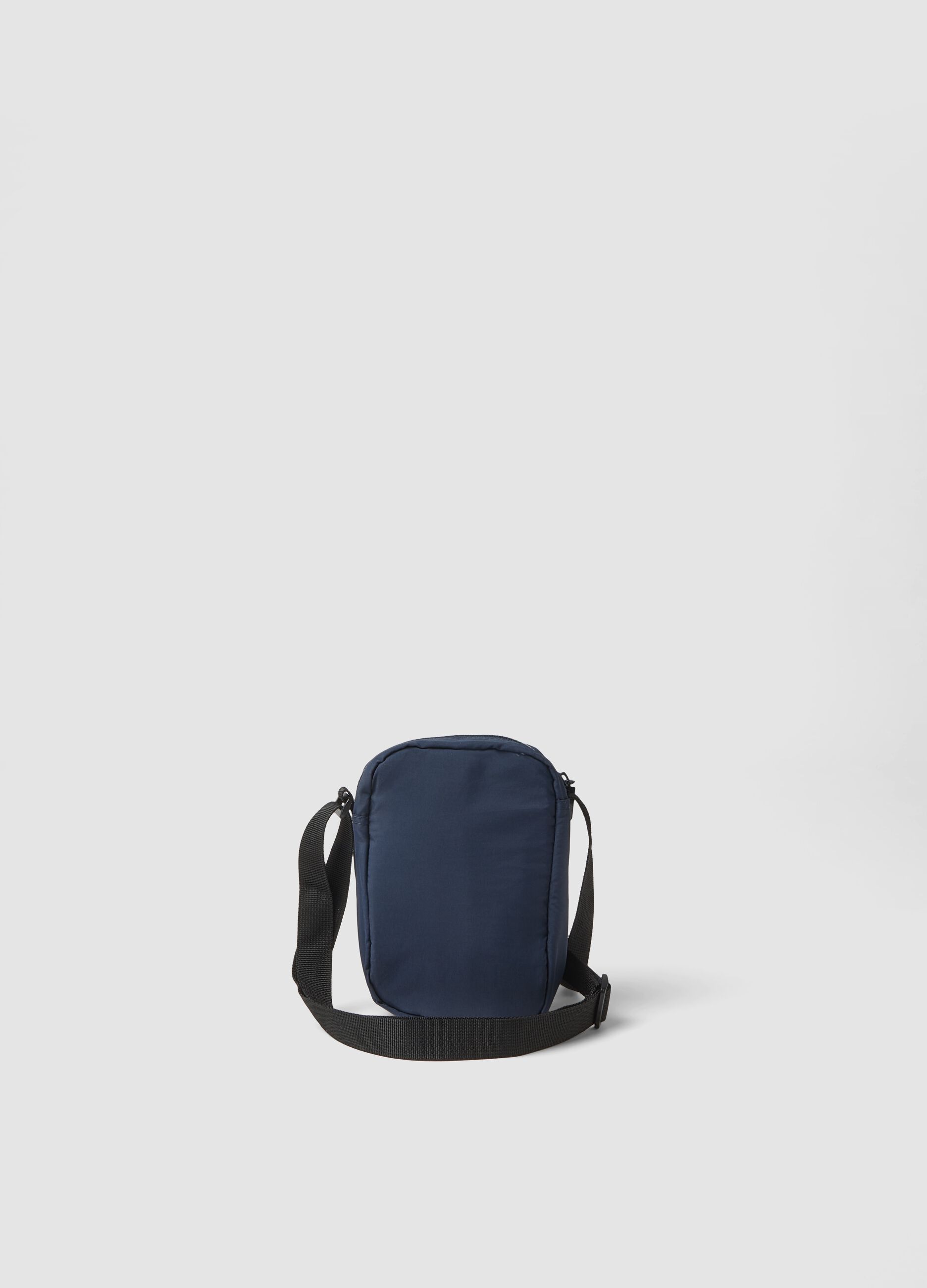 Blue crossbody bag with zip fastening and adjustable strap