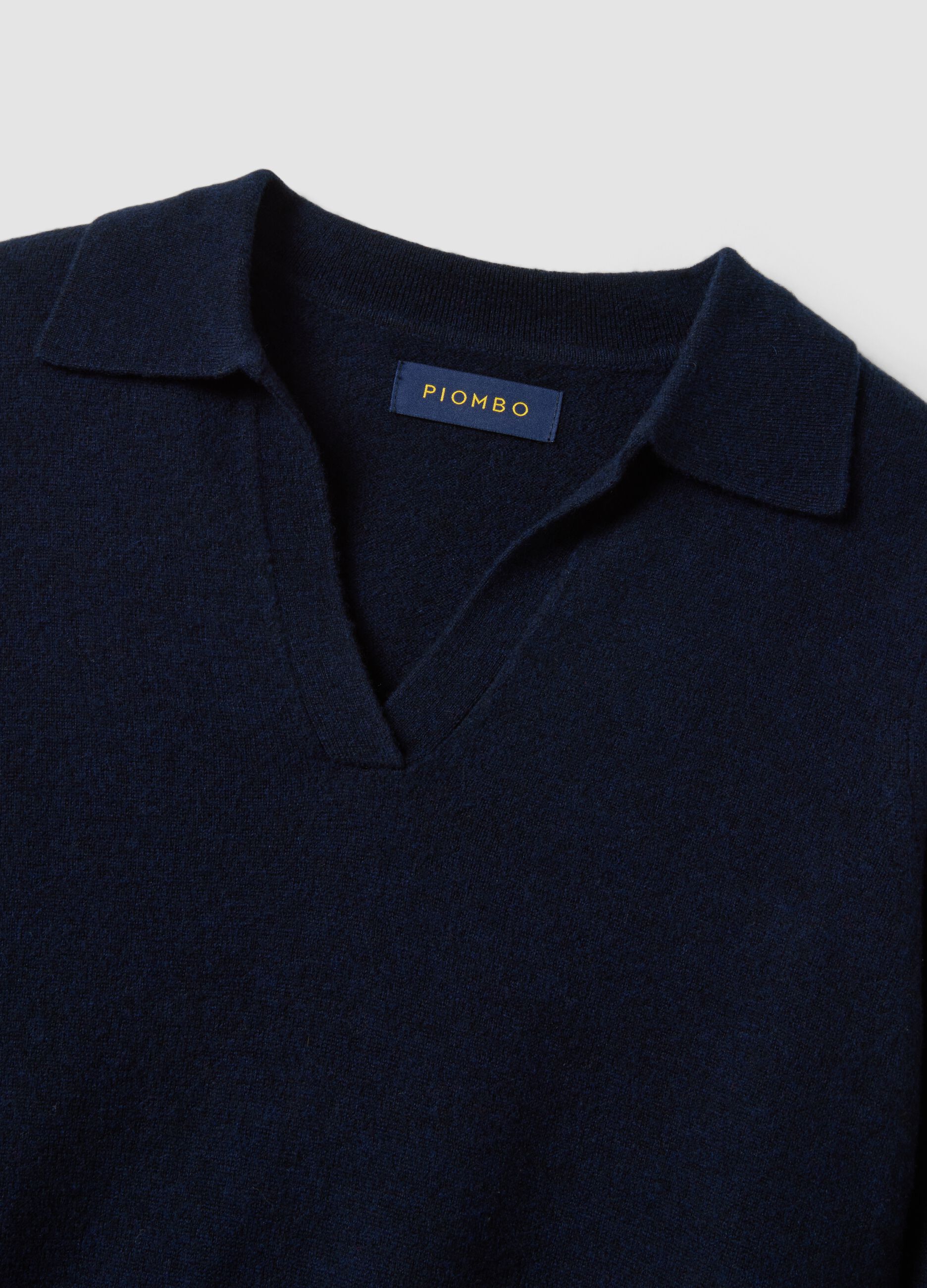 Maglia blu in pura lana con colletto polo