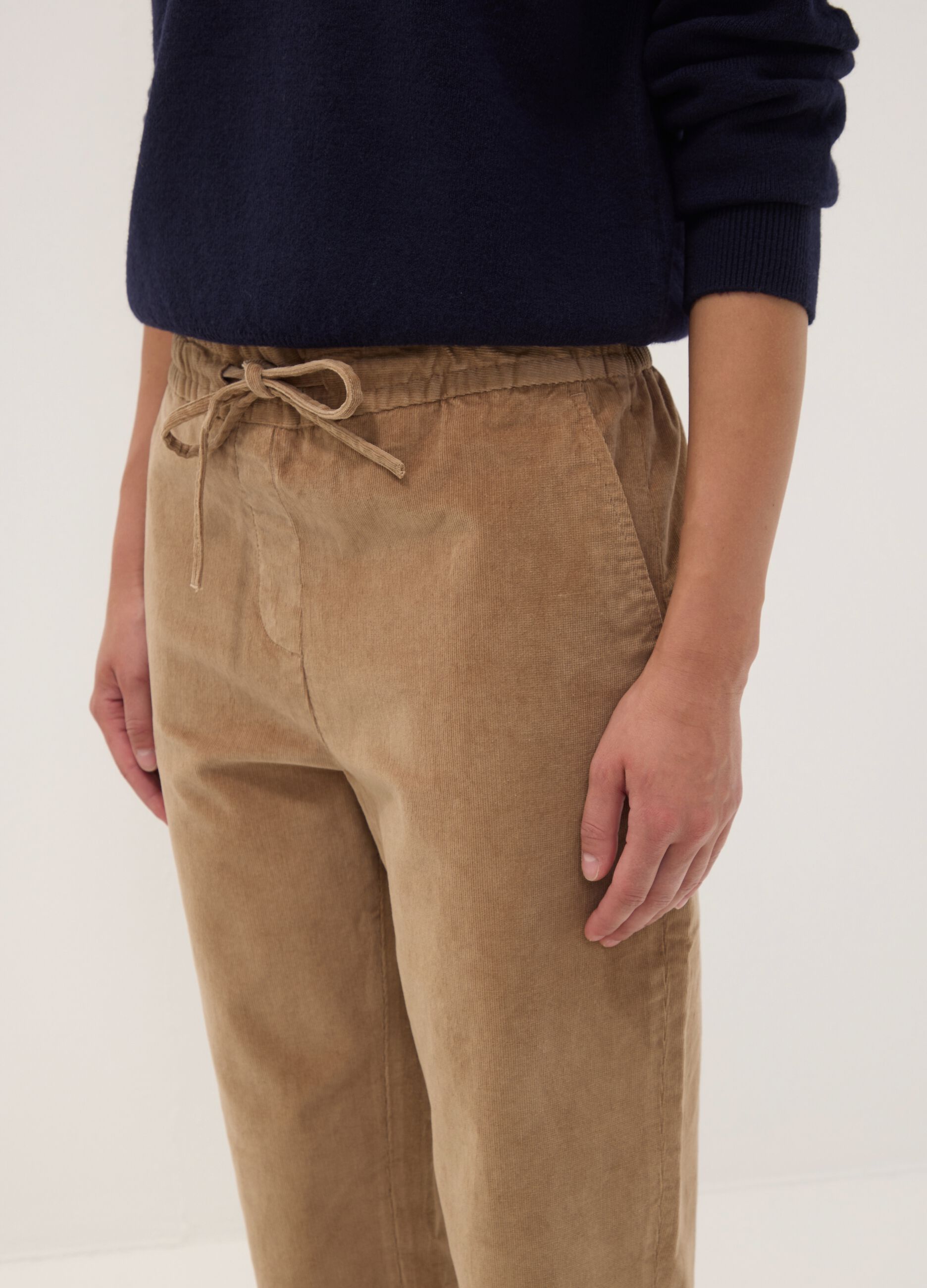 Beige ribbed stretch cotton trousers with elasticated waistband