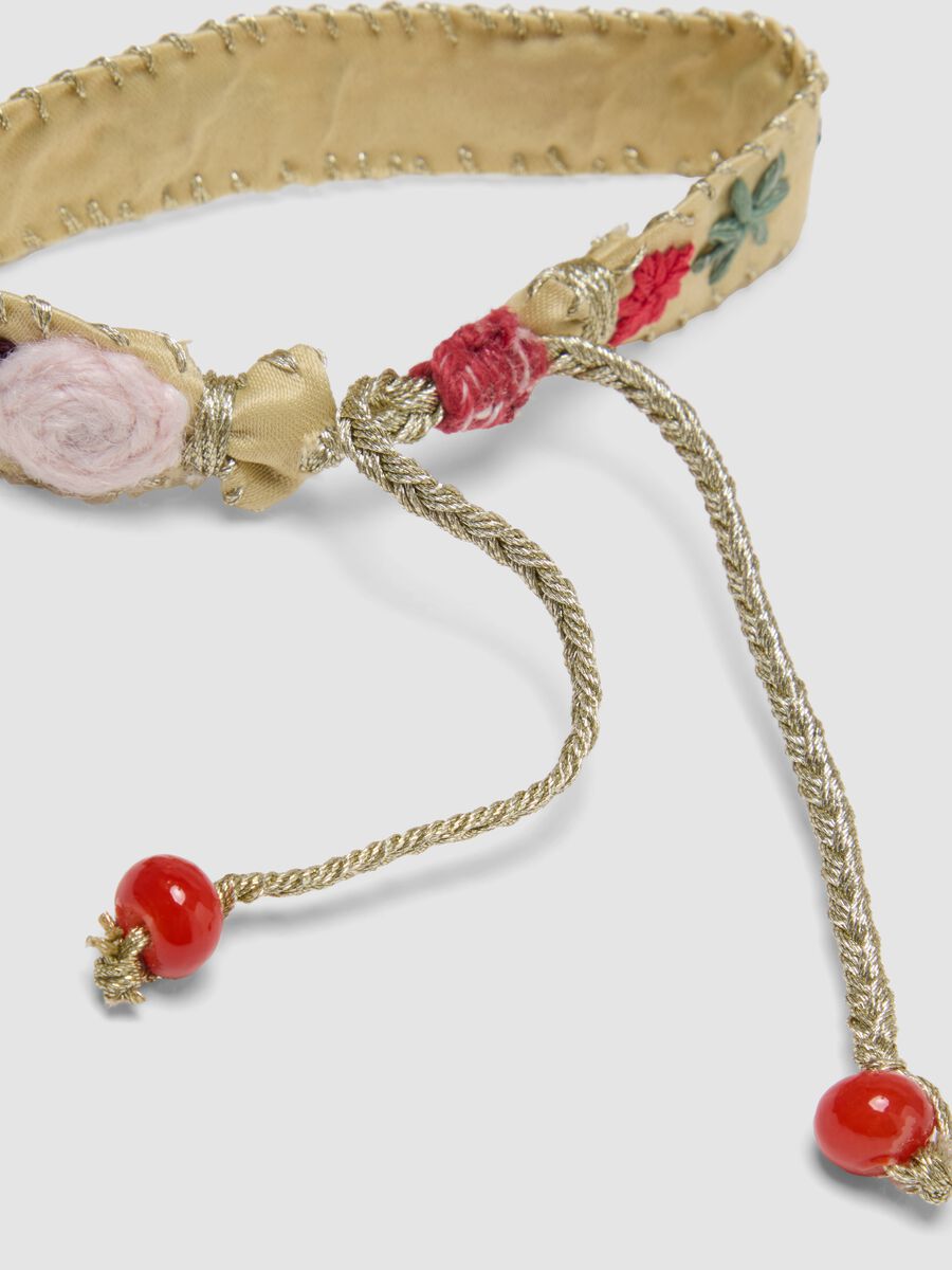 Beige embroidered bracelet with adjustable tie cords_1