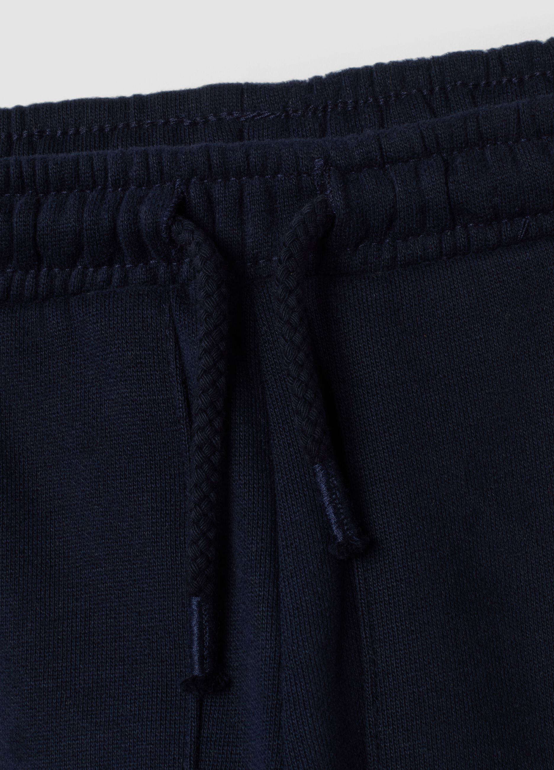 Pantaloni jogger blu in puro cotone con motivo animalier