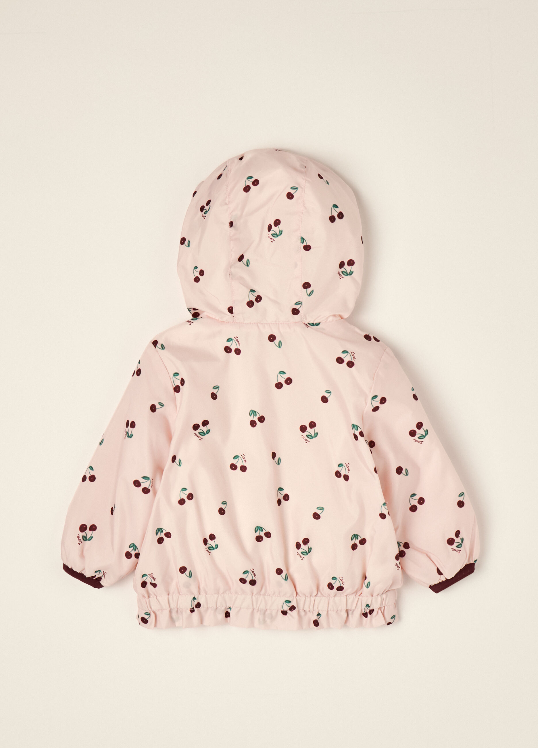 Pink padded hooded jacket with cherry print