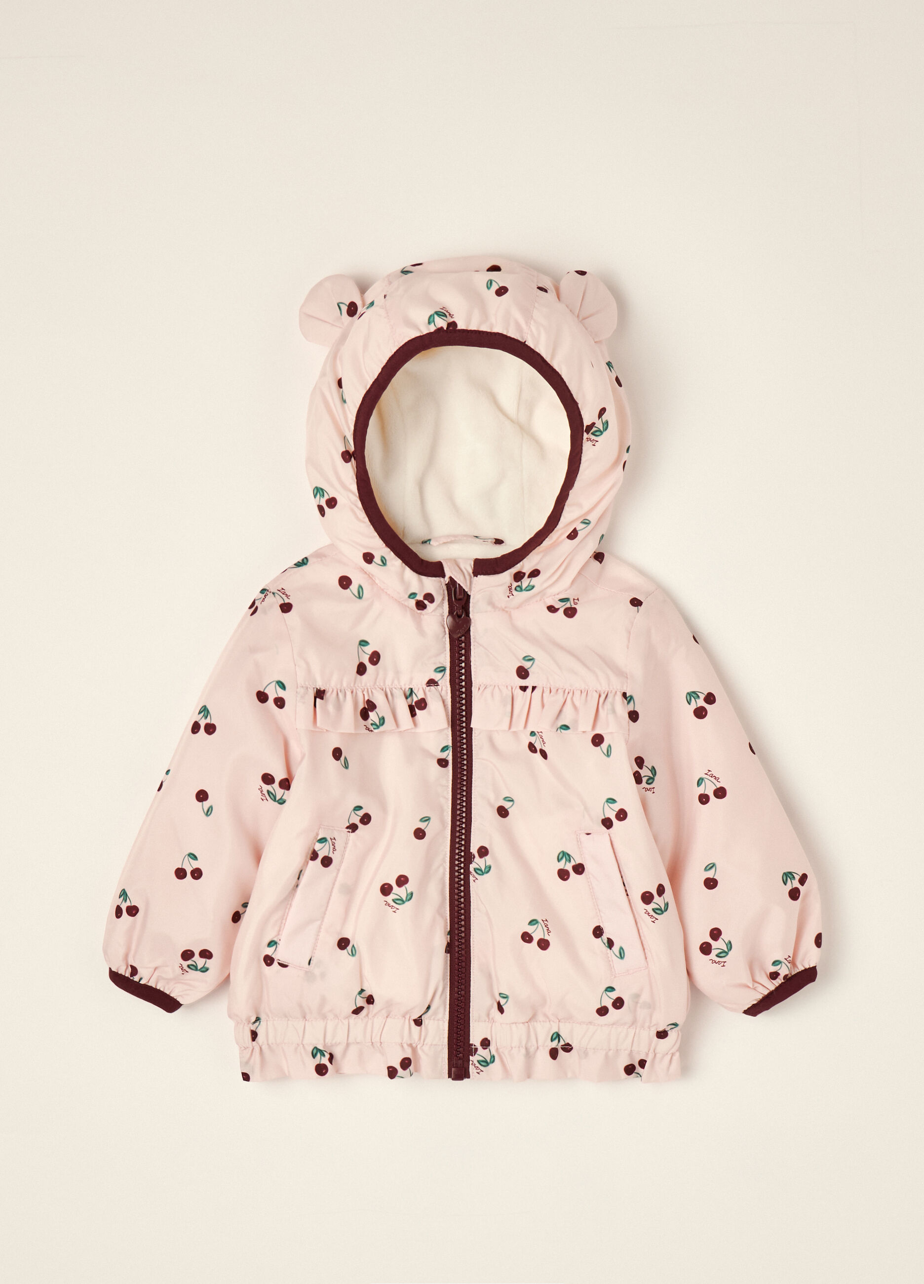 Pink padded hooded jacket with cherry print