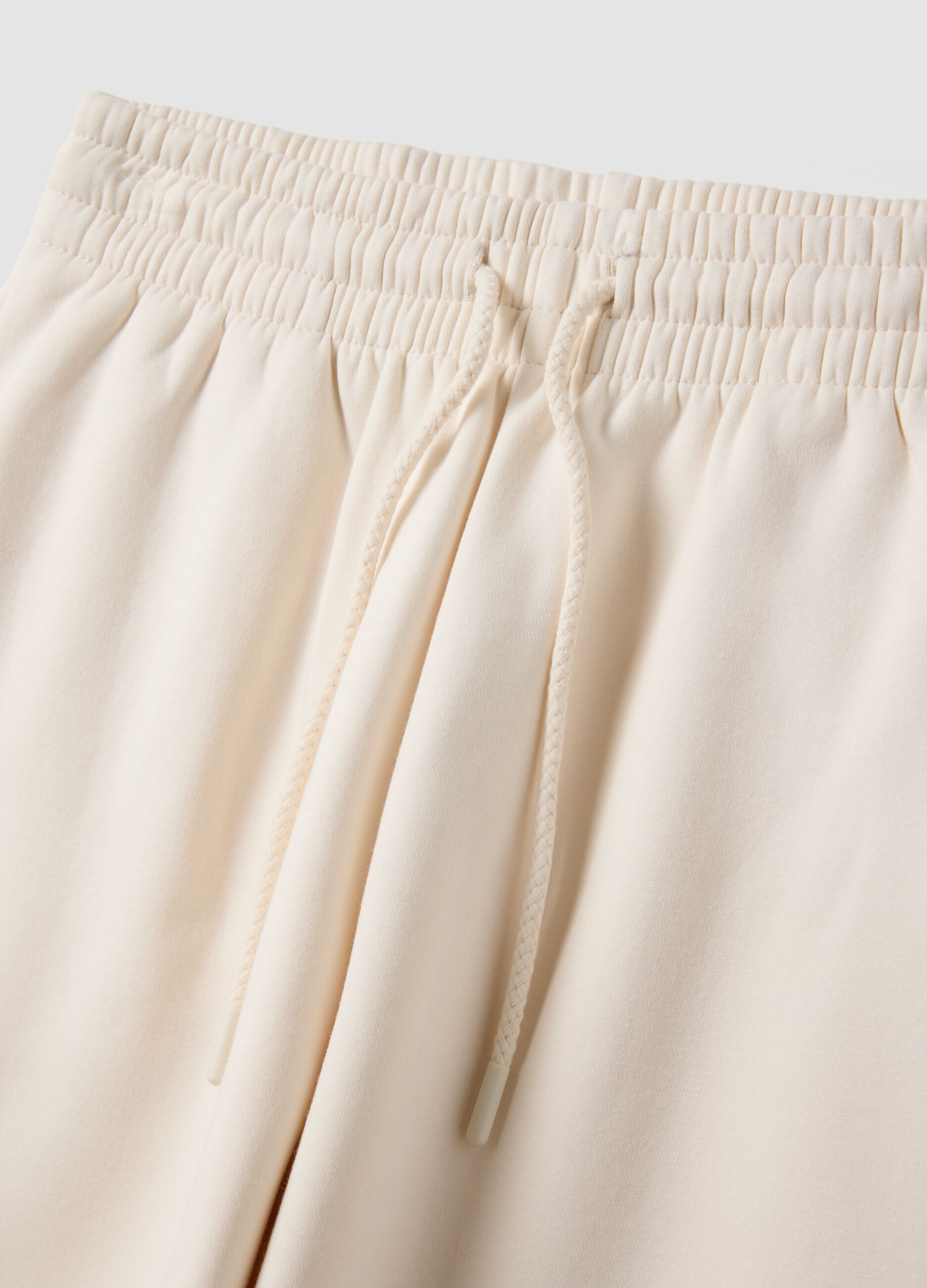 White cotton-blend joggers with elasticated waistband, regular fit
