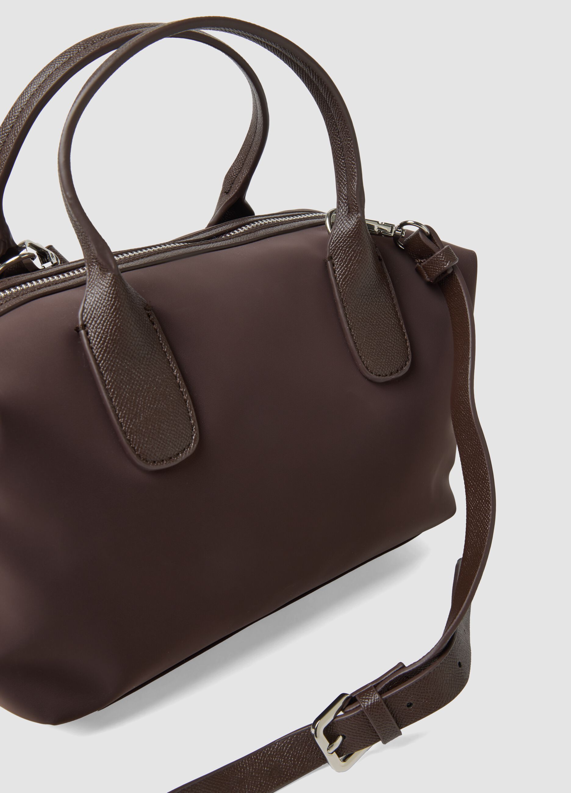 Brown handbag with adjustable shoulder strap
