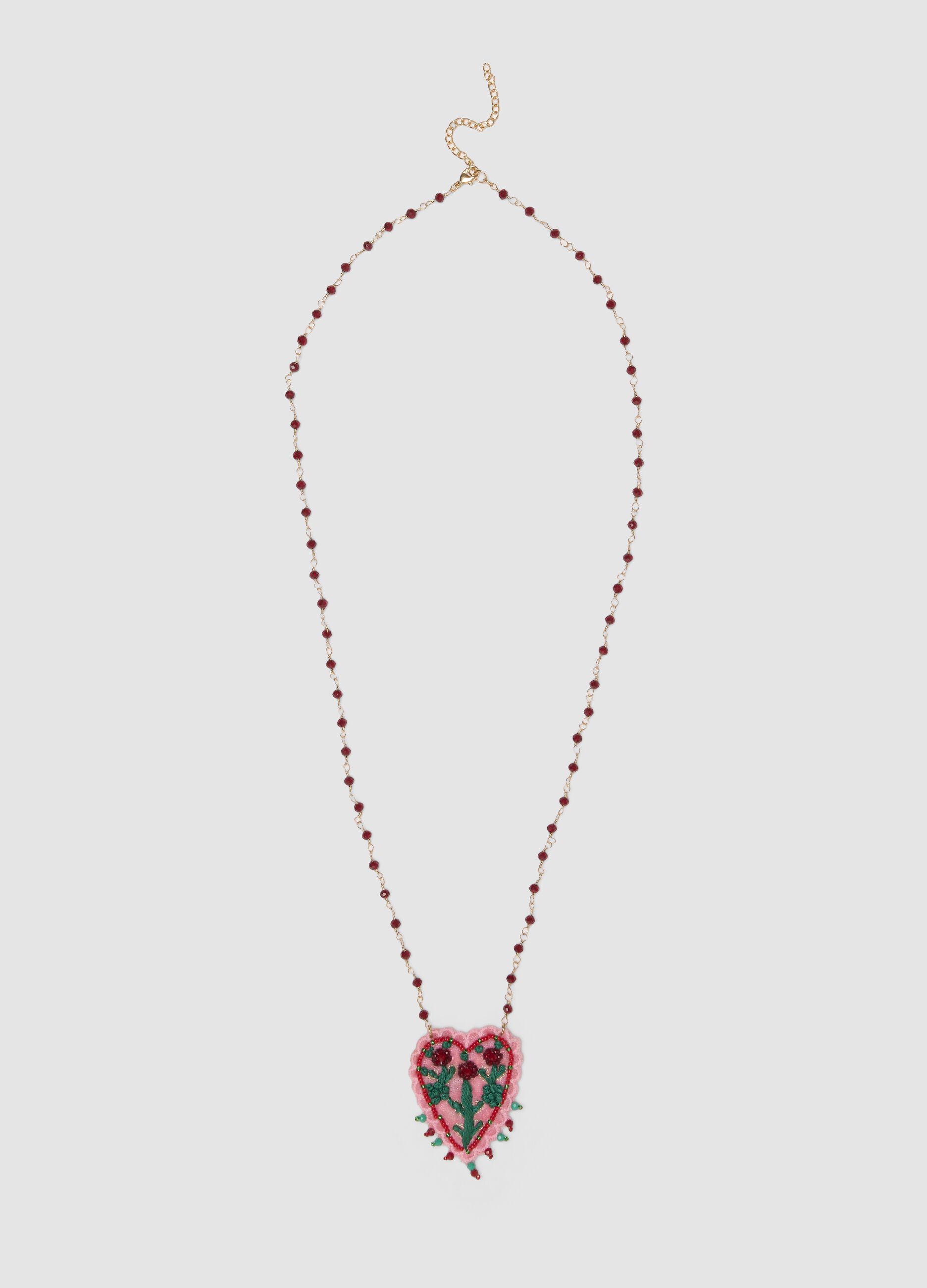 Pink necklace with embroidered heart pendant