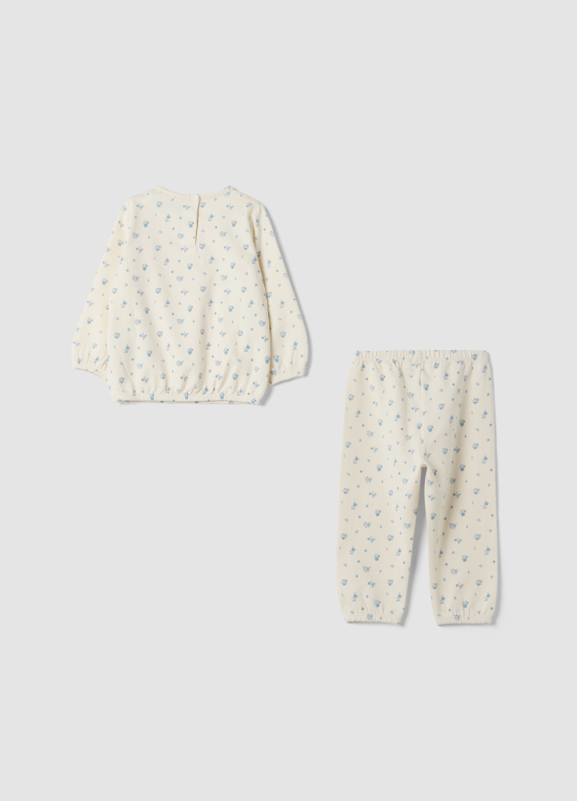 White organic cotton baby pyjamas with all-over print