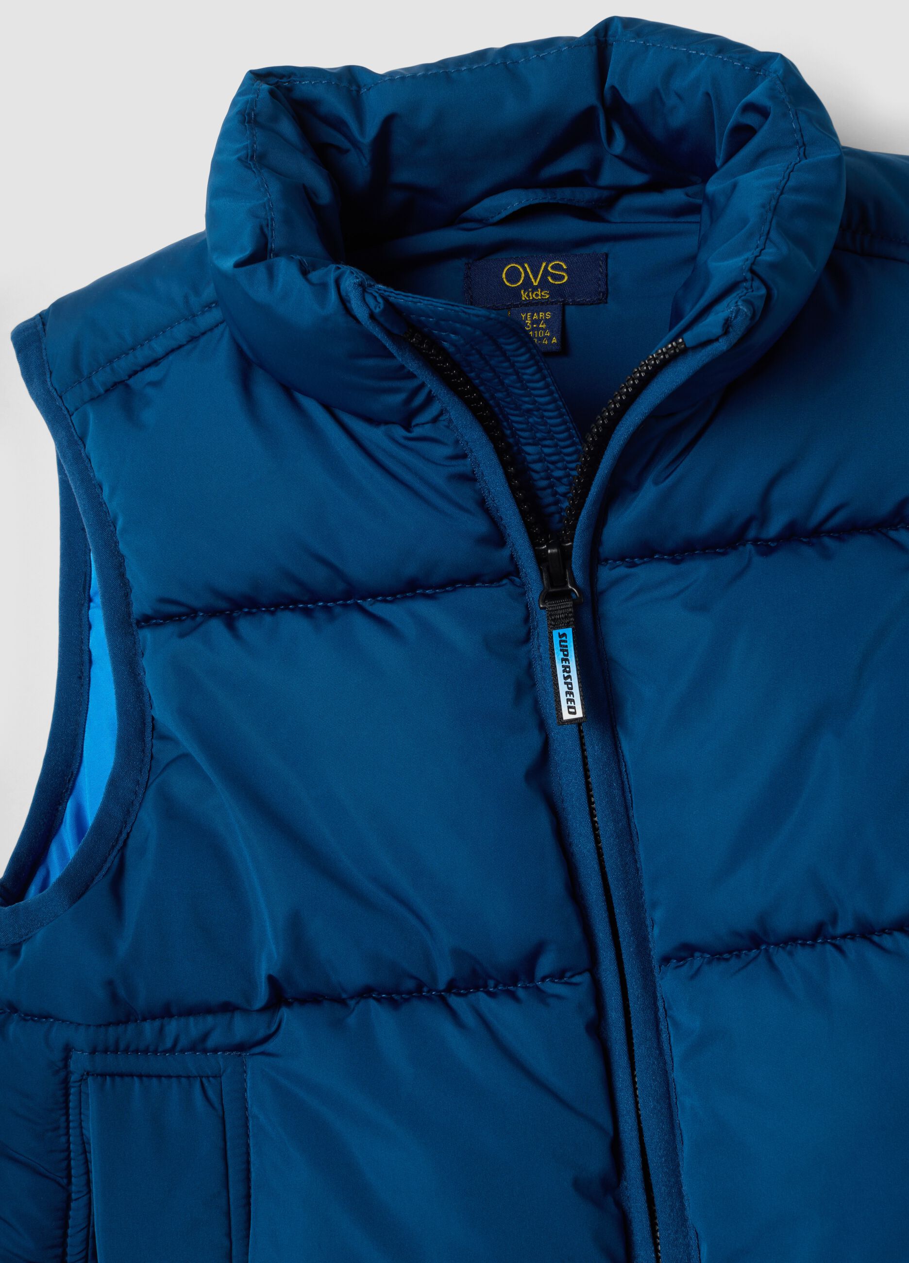 Blue padded gilet with zip and high neck, regular fit