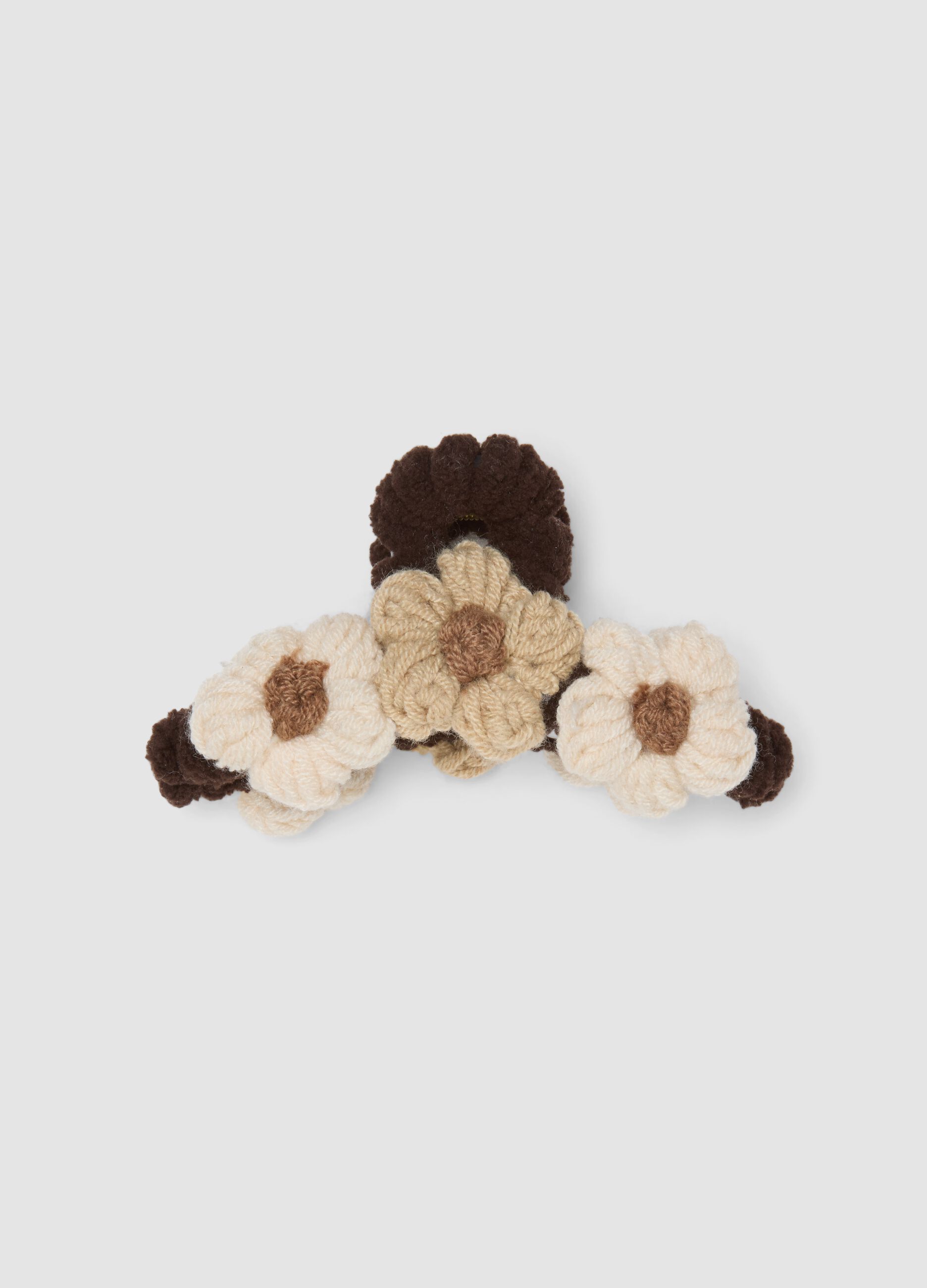 Brown hair claw clip with textured floral details