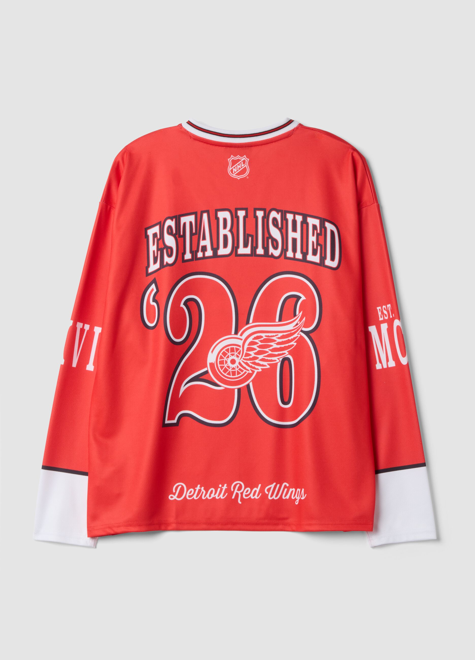 Red and white hockey-style T-shirt with Detroit Red Wings print